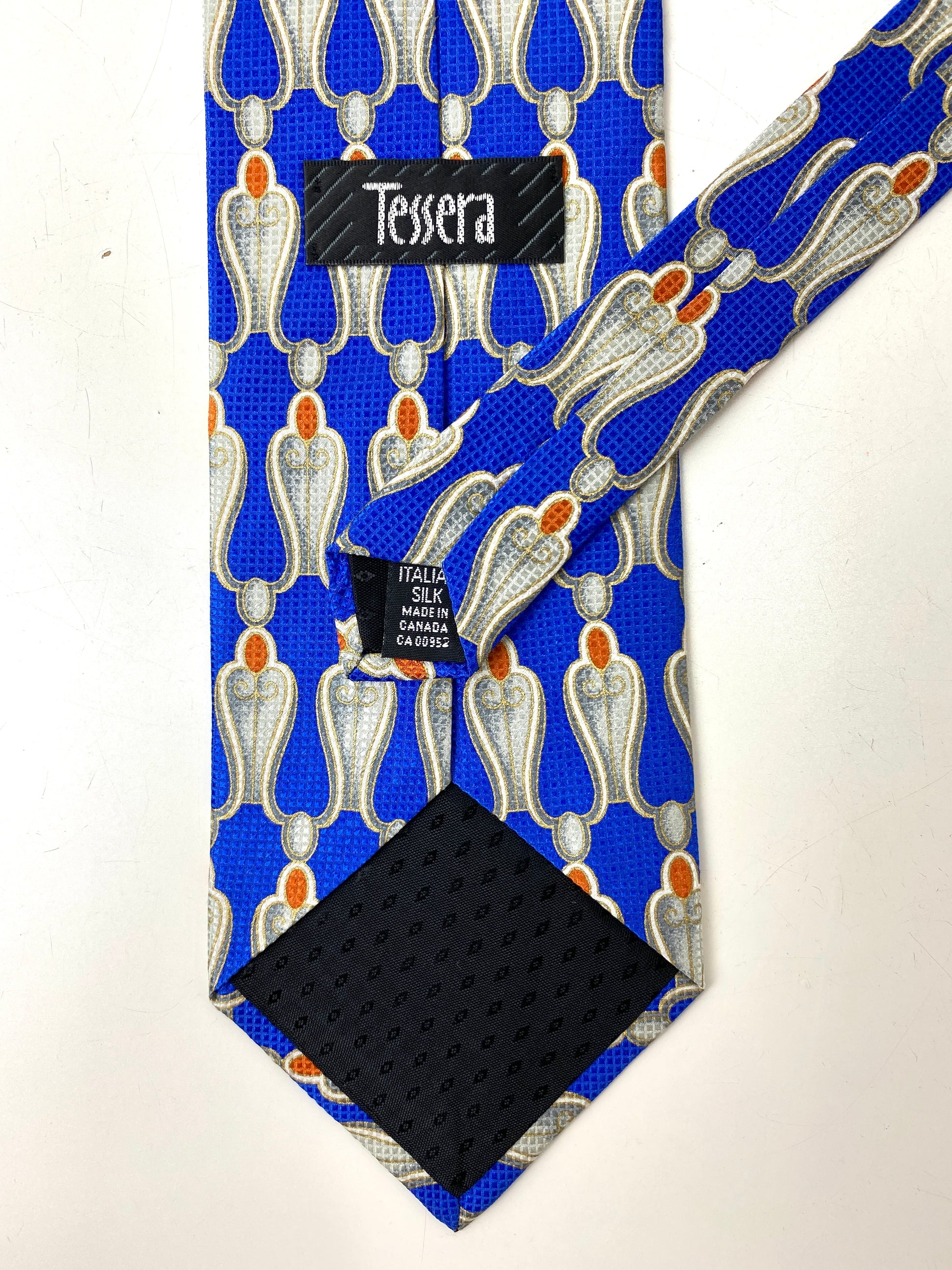 Back and labels of: 90s Deadstock Silk Necktie, Men's Vintage Blue/Silver/Gold Pattern Tie, NOS