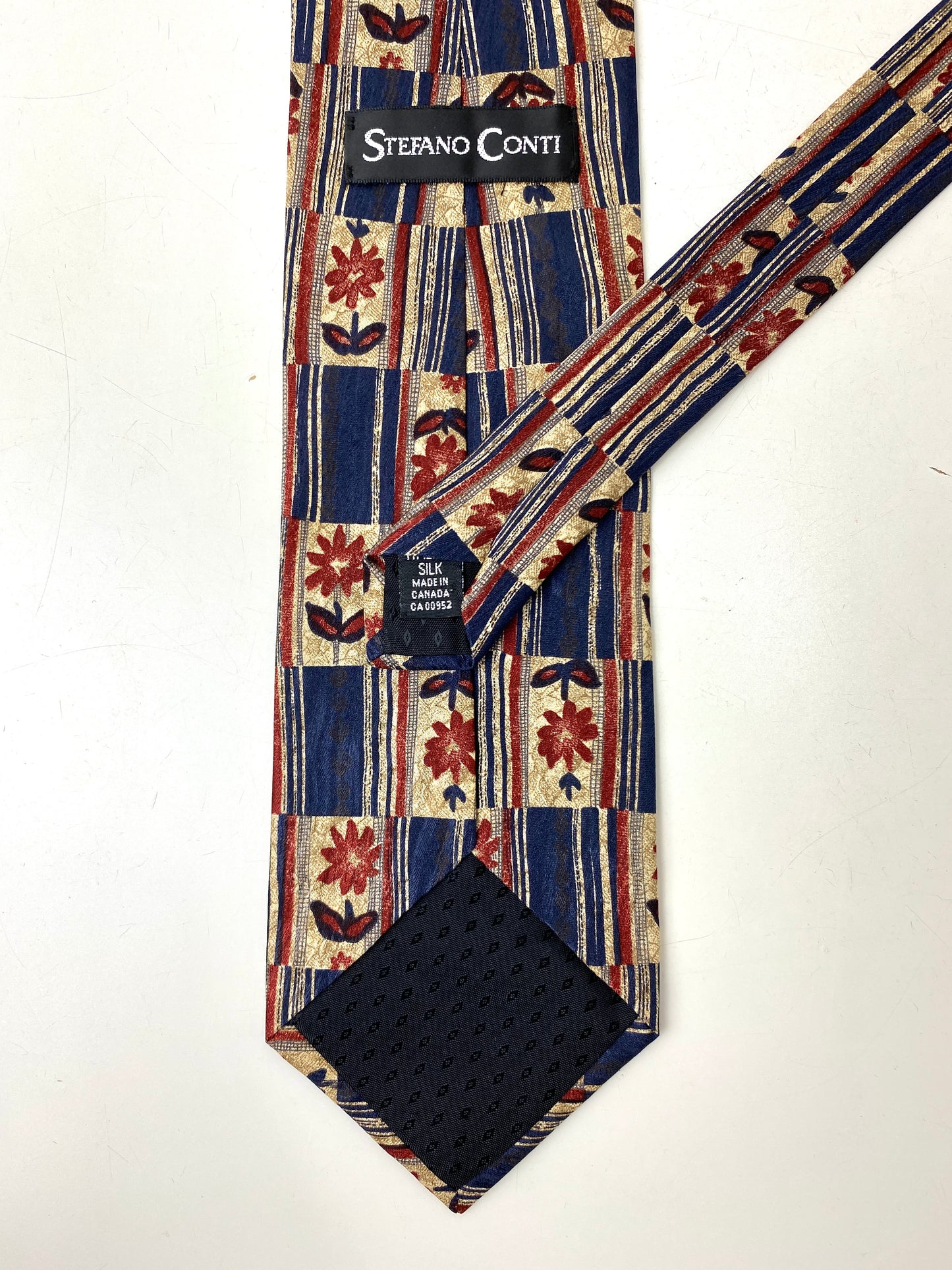 Back and labels of: 90s Deadstock Silk Necktie, Men's Vintage Blue Red Floral Pattern Tie, NOS