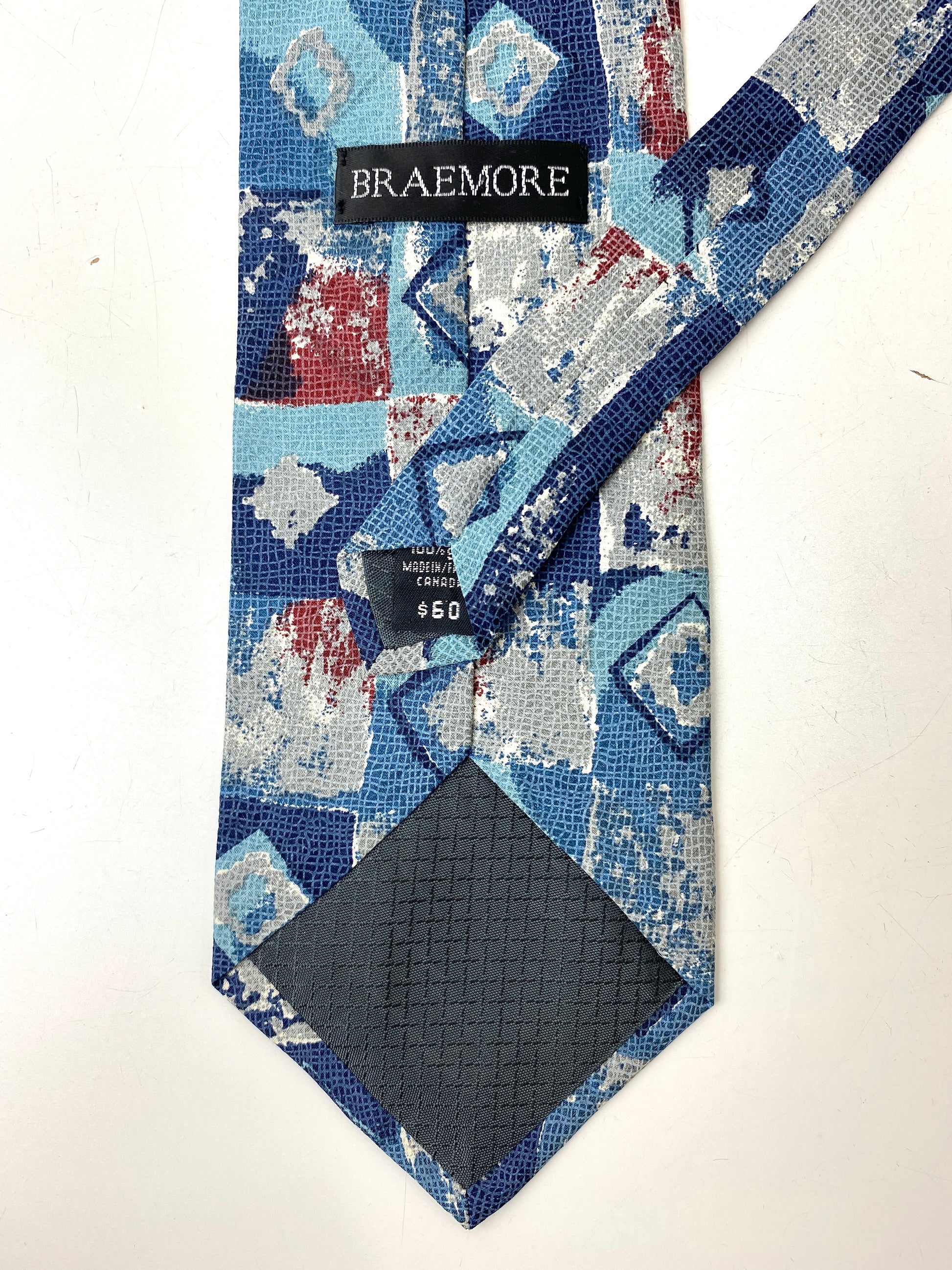 Back and labels of: 90s Deadstock Silk Necktie, Men's Vintage Blue/Red Diamond Square Pattern Tie, NOS