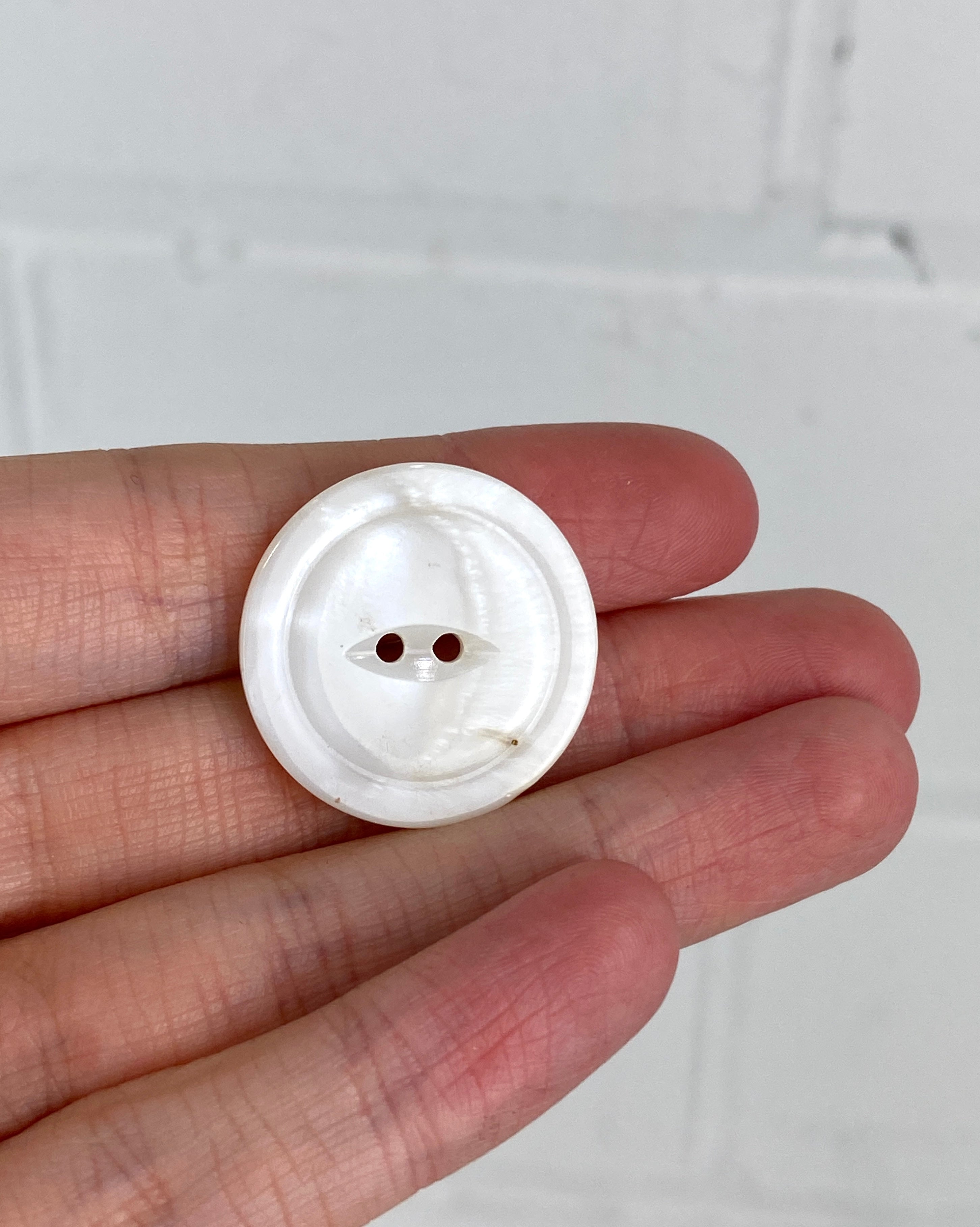 Large white clearance buttons