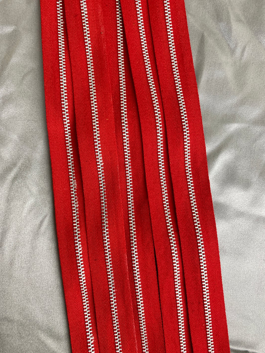 A batch of vintage red metal zippers. Ian Drummond Vintage. 