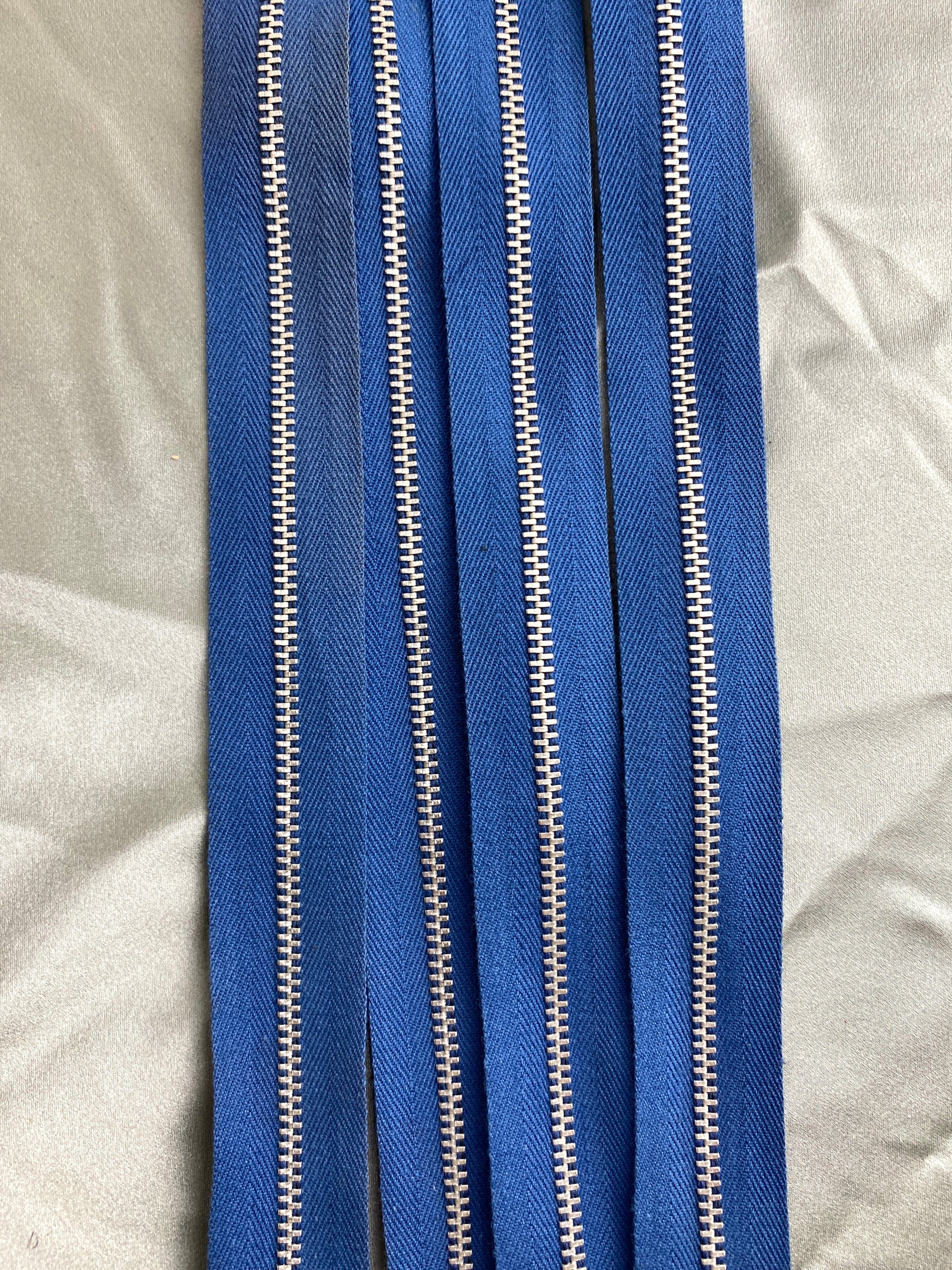 A batch of vintage dark blue metal zippers. Ian Drummond Vintage. 