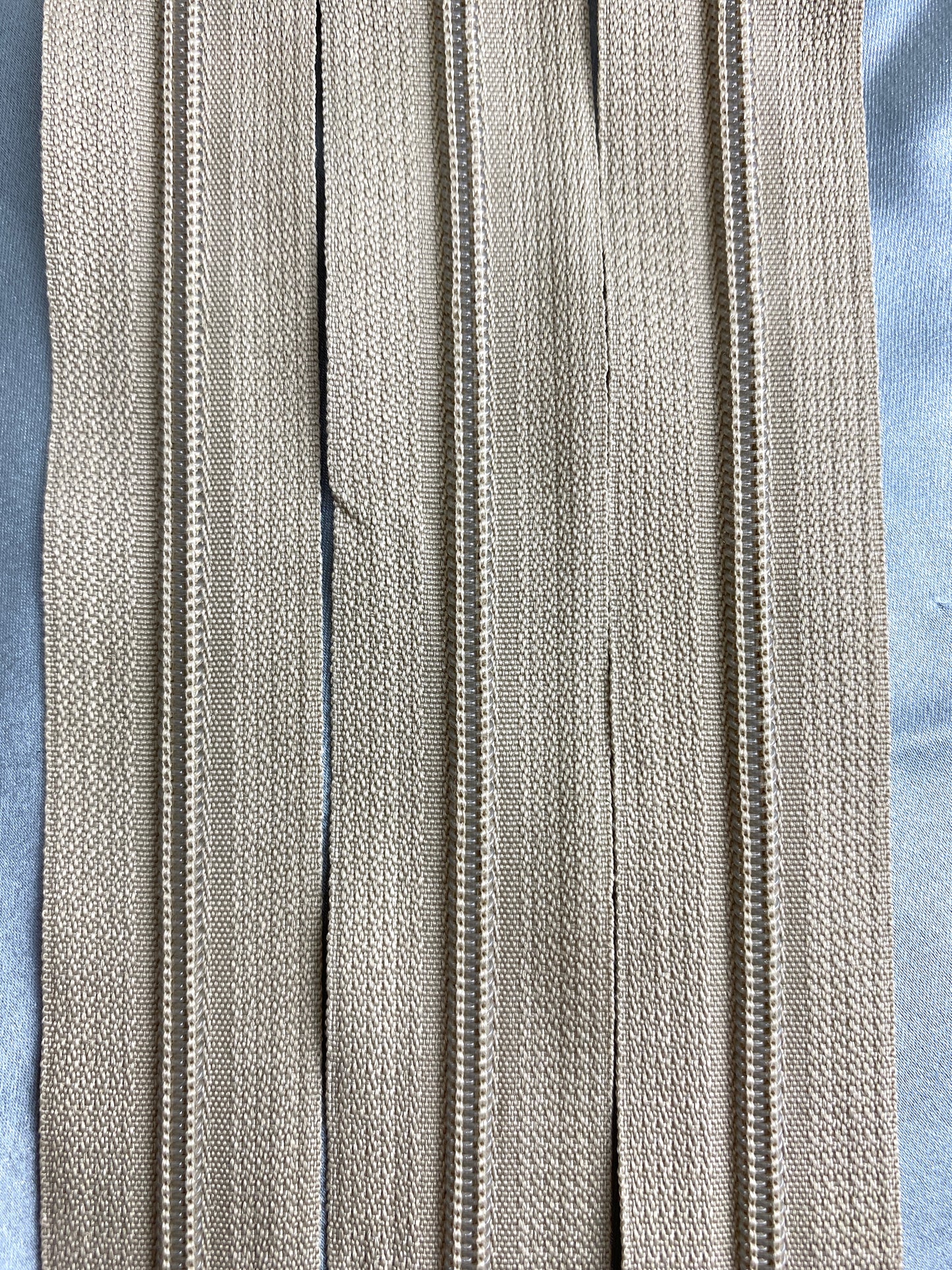 Medium tan vintage plastic zippers. Ian Drummond Vintage.