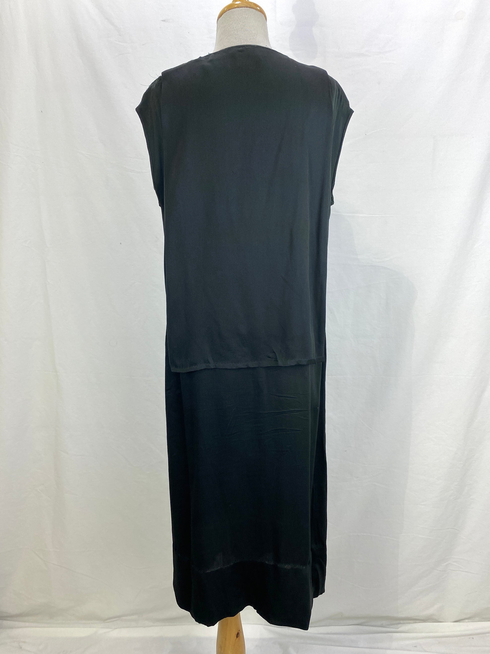 Back view of 1920s black silk sleeveless beaded dress. Ian Drummond Vintage. 