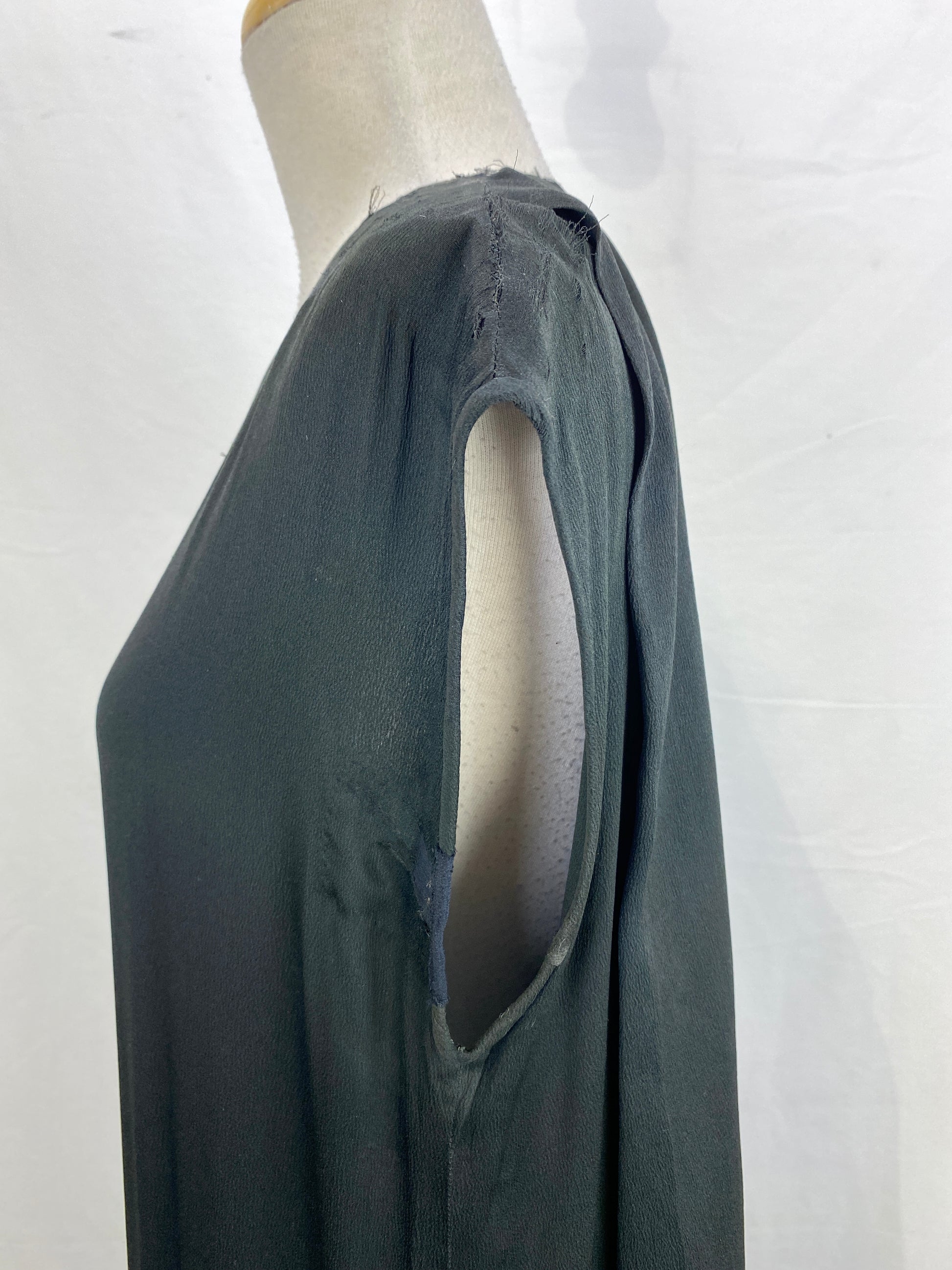 Clos-up off armhole on 1920s black silk beaded dress. Ian Drummond Vintage. 