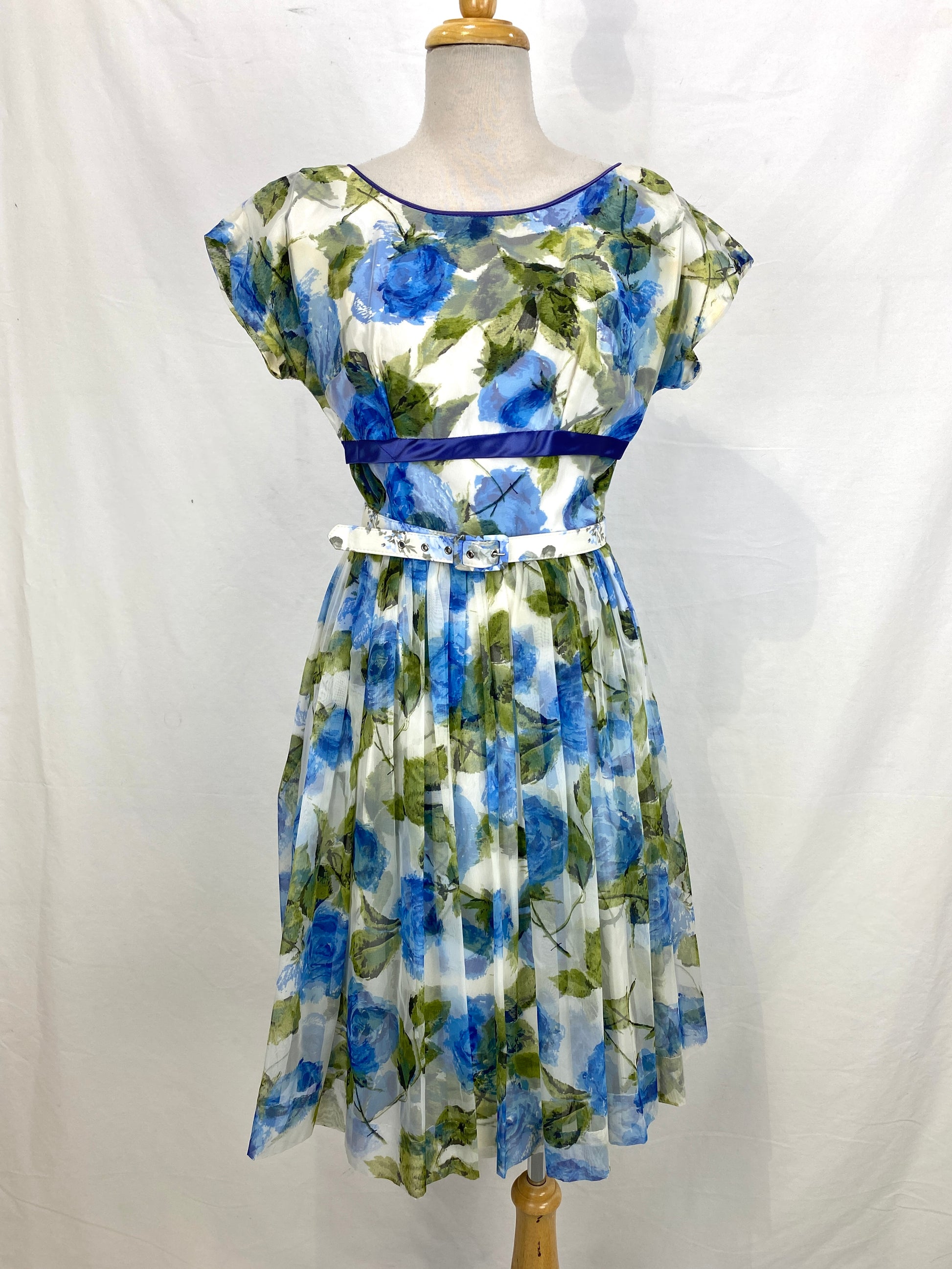 Front view of a 1950s green & blue floral tea dress. Ian Drummond Vintage. 