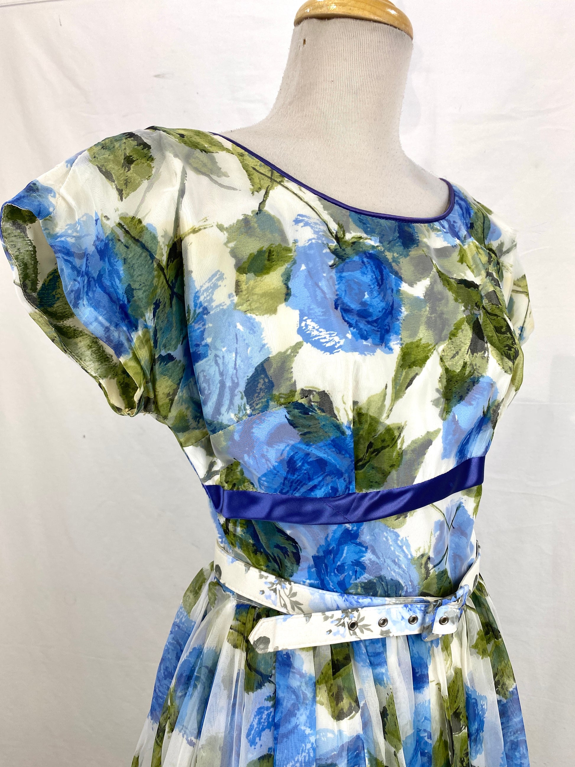 3/4 close-up of 50s floral nylon cocktail dress. Ian Drummond Vintage. 