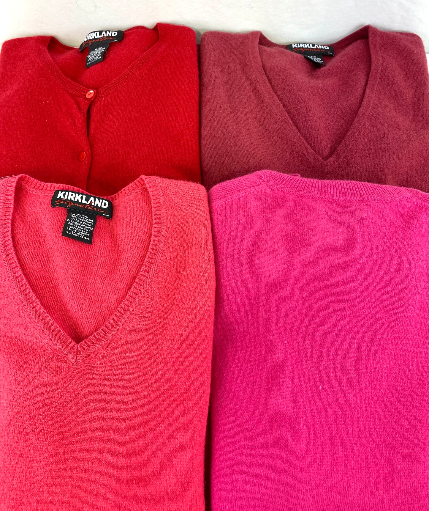 4 vintage cashmere sweaters folded side by side. Ian Drummond Vintage. 