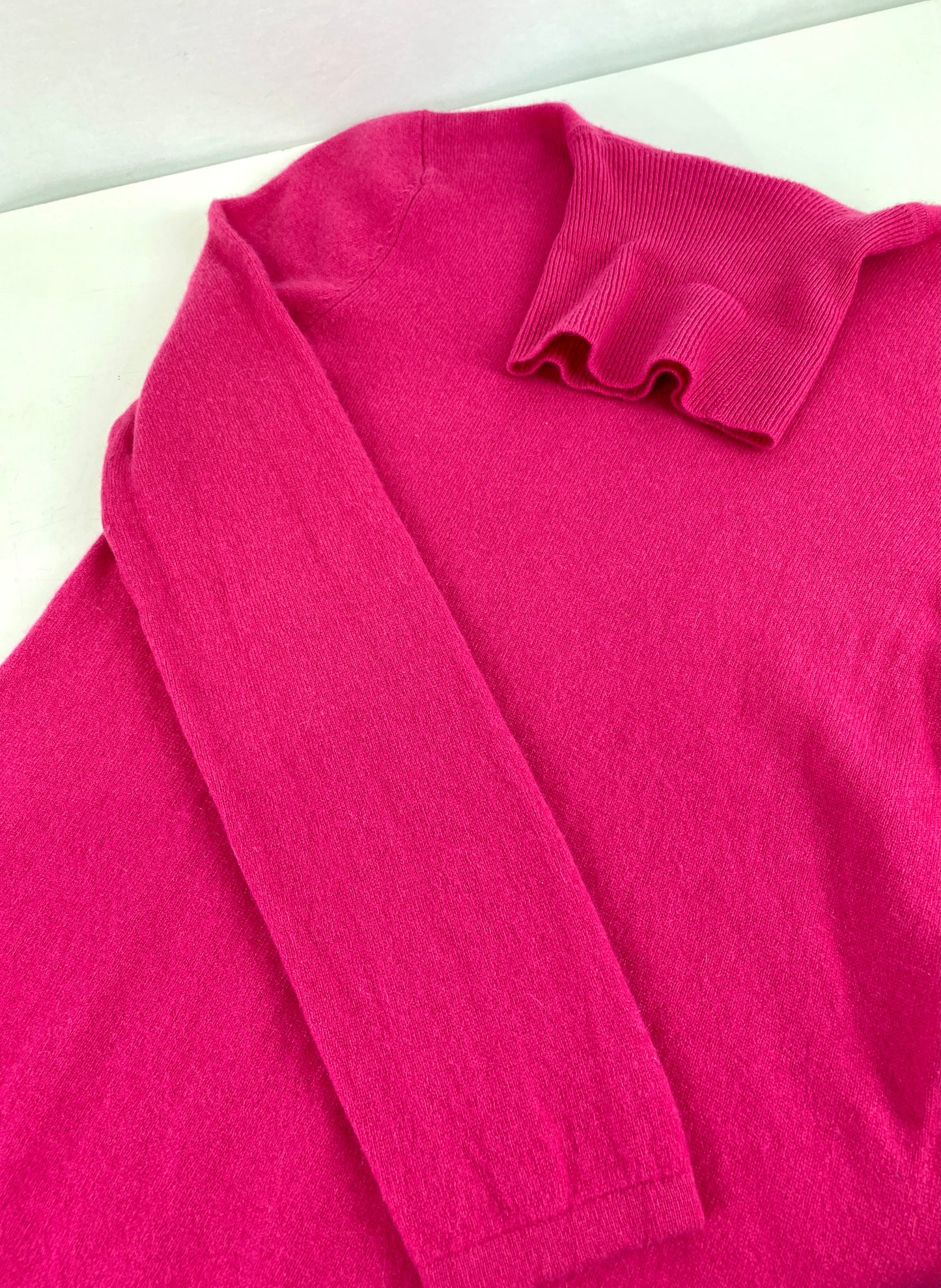 Pink turtleneck cashmere sweater laying flat. Ian Drummond Vintage. 