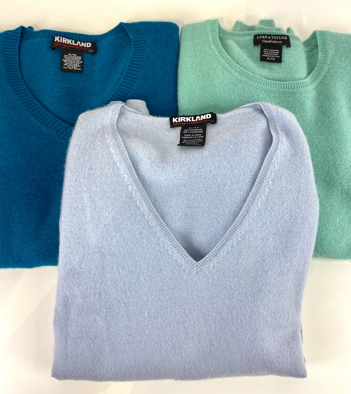 3 folded vintage cashmere pullovers. blues and greens. Ian Drummond Vintage.