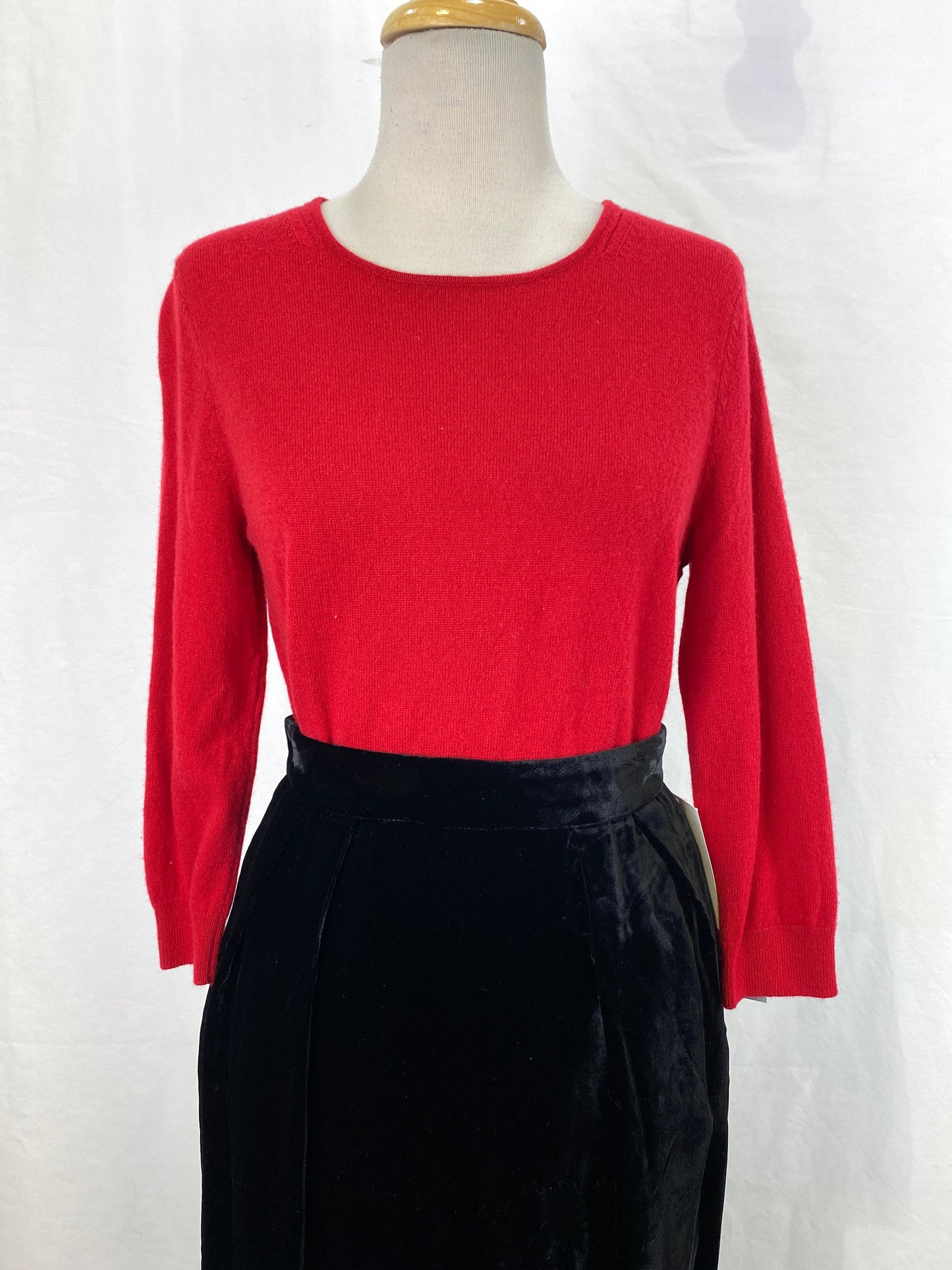 Red cashmere sweater tucked into black skirt on mannequin. Ian Drummond Vintage. 