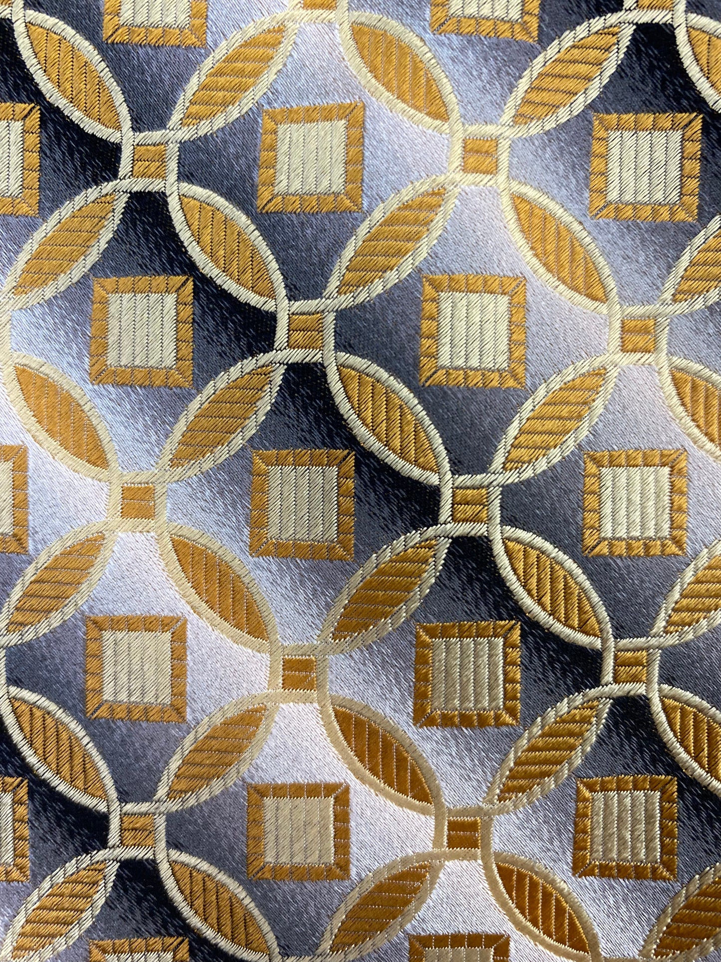 Close-up detail of pattern: 90s Deadstock Silk Necktie, Men's Vintage Gold Grey Medallion With Diagonal Stripe Pattern Tie, NOS