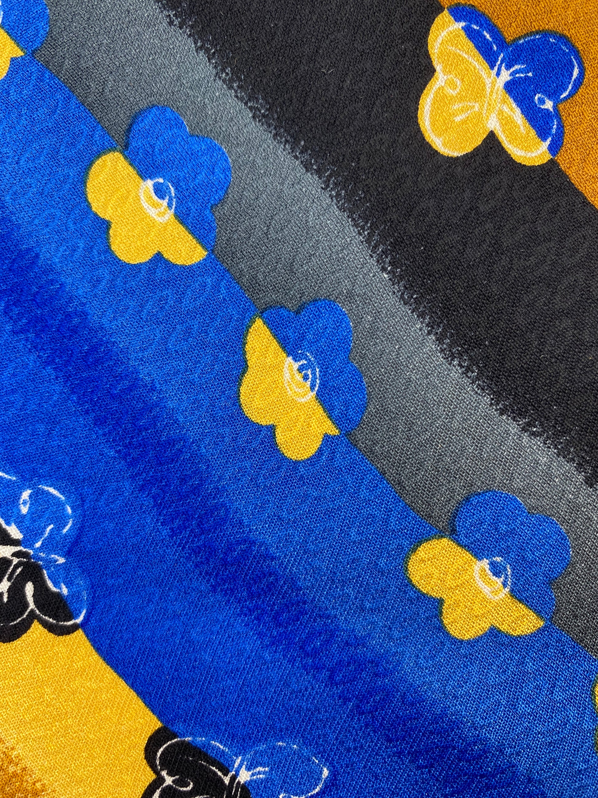 Close-up detail of: 90s Deadstock Silk Necktie, Men's Vintage Gold/Blue/Black Diagonal Stripe Floral Butterfly Pattern Tie, NOS