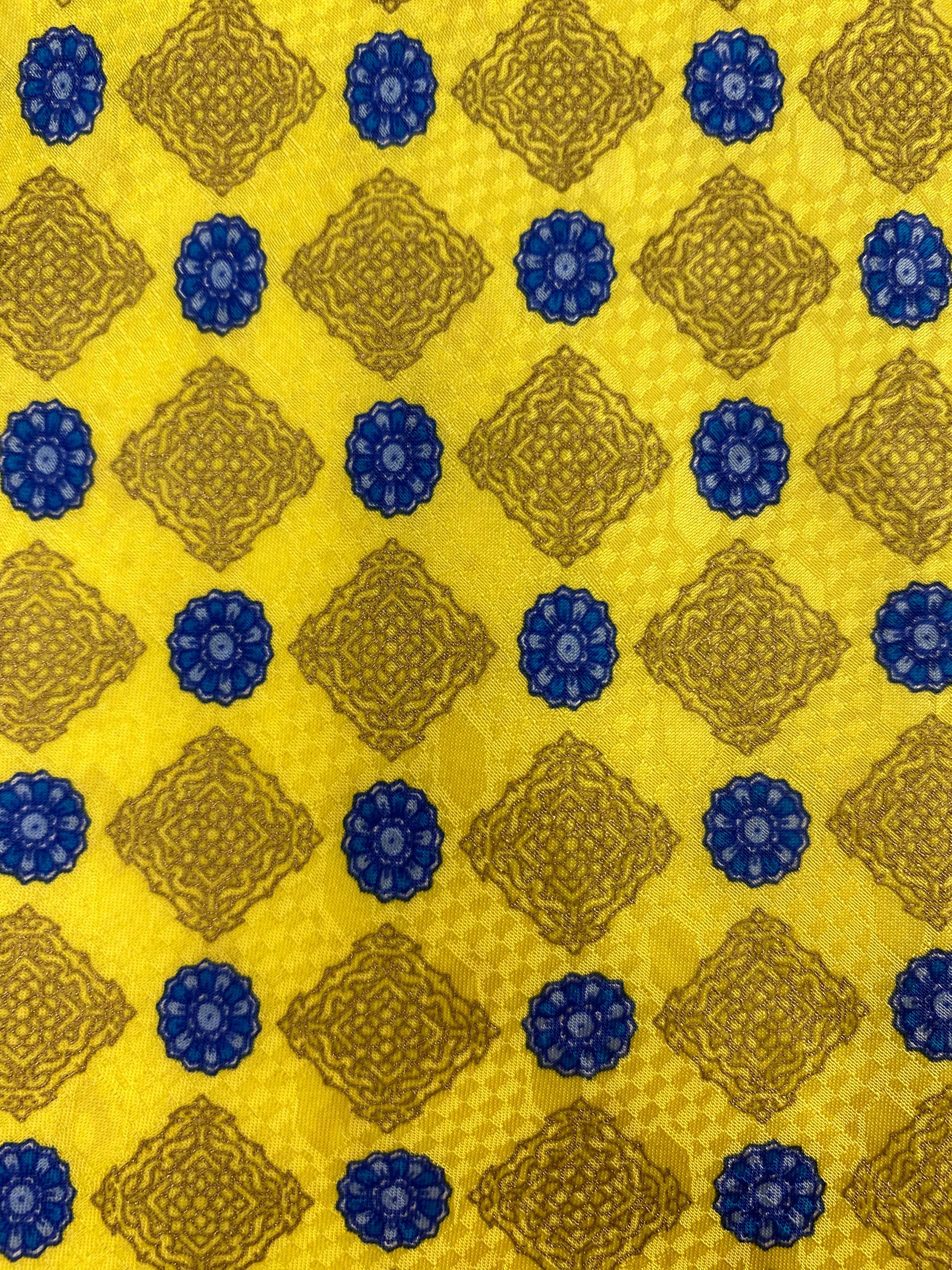 Close-up pattern detail of: 90s Deadstock Silk Necktie, Men's Vintage Yellow/Gold/Blue Medallion Pattern Tie, NOS
