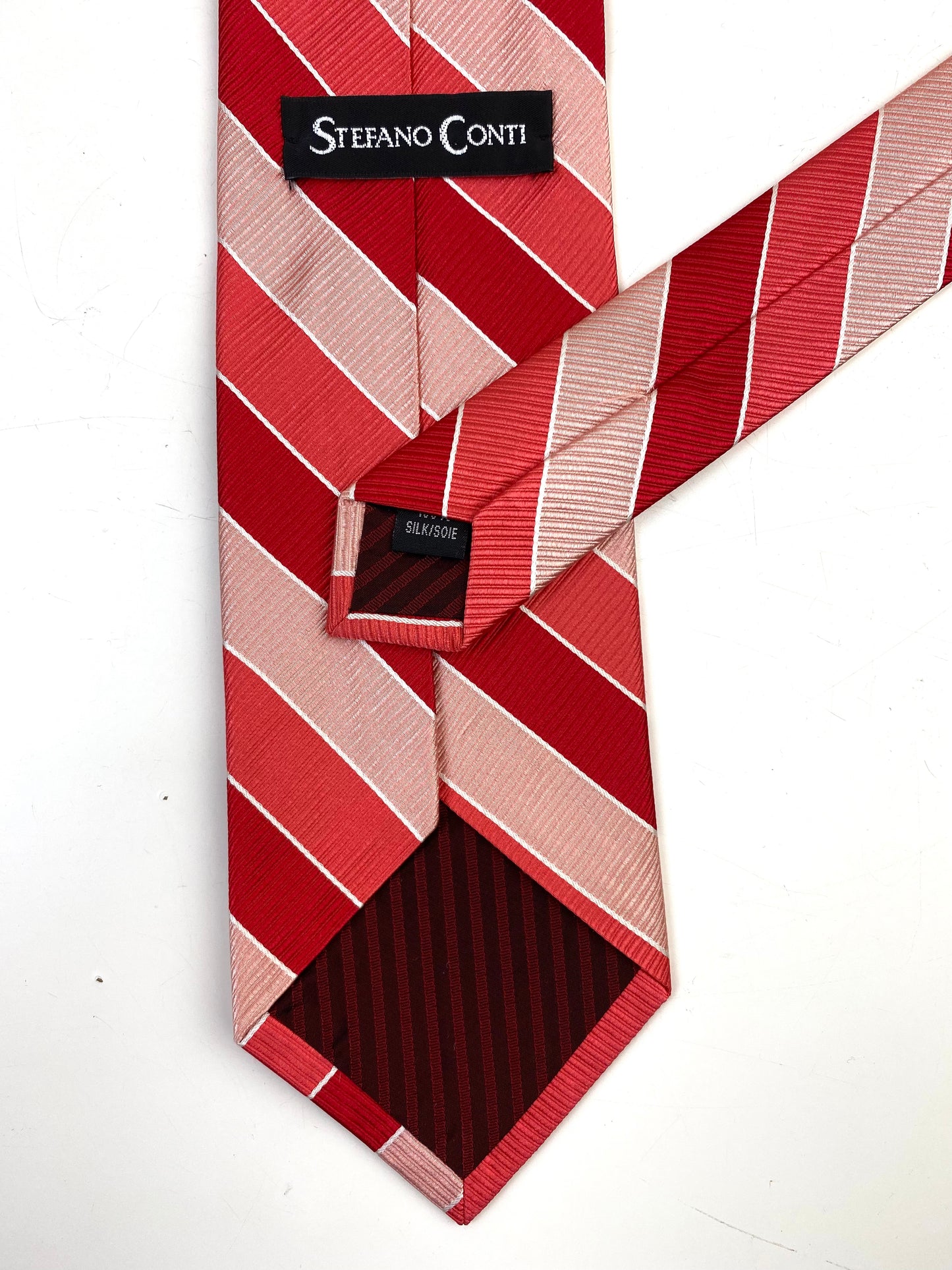 Back and labels of: 90s Deadstock Silk Necktie, Men's Vintage Red/Pink Diagonal Repp Stripe Pattern Tie, NOS