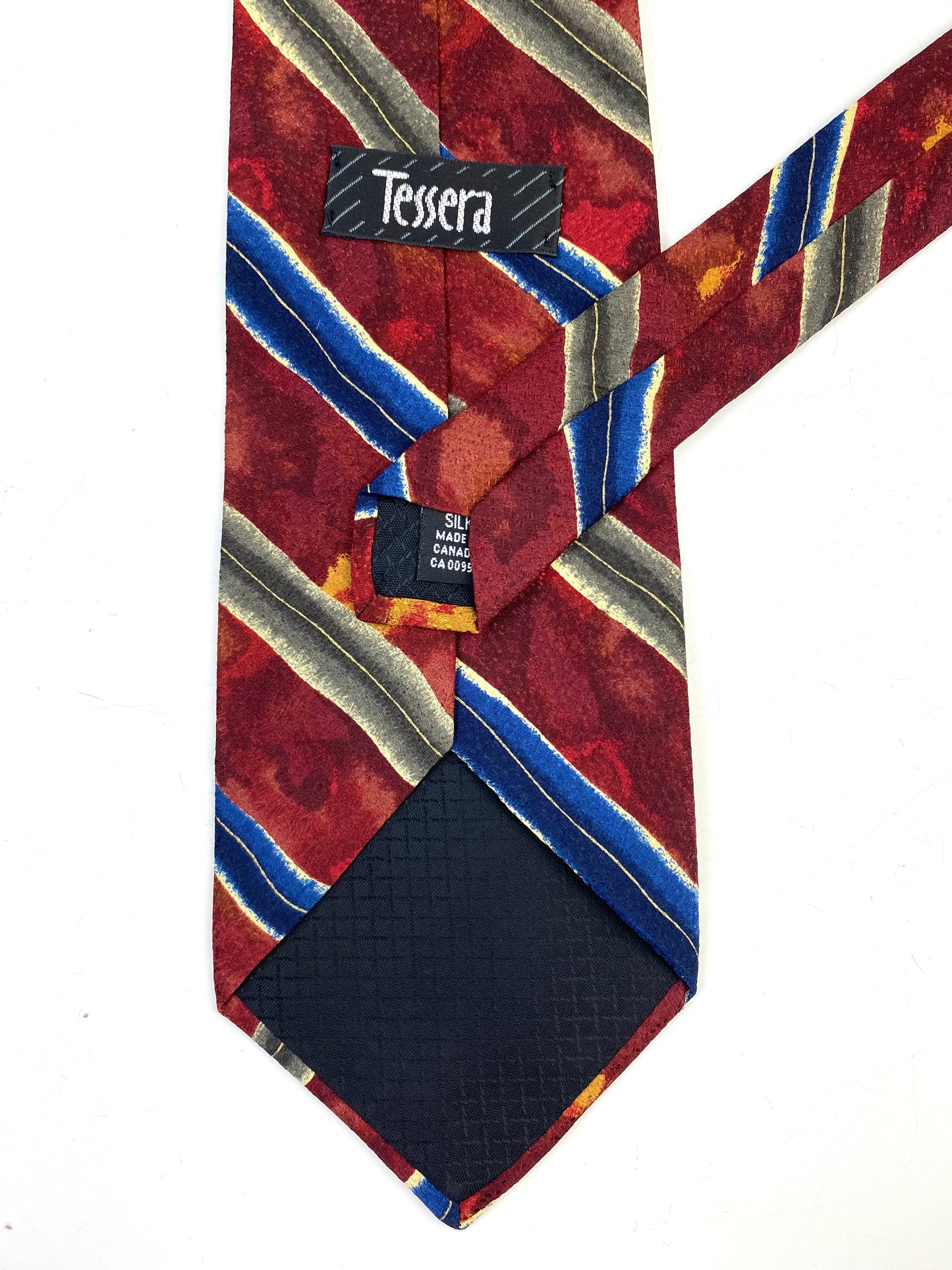 Back and labels of: 90s Deadstock Silk Necktie, Men's Vintage Wine/ Green/ Blue Watercolour Diagonal Stripe Pattern Tie, NOS