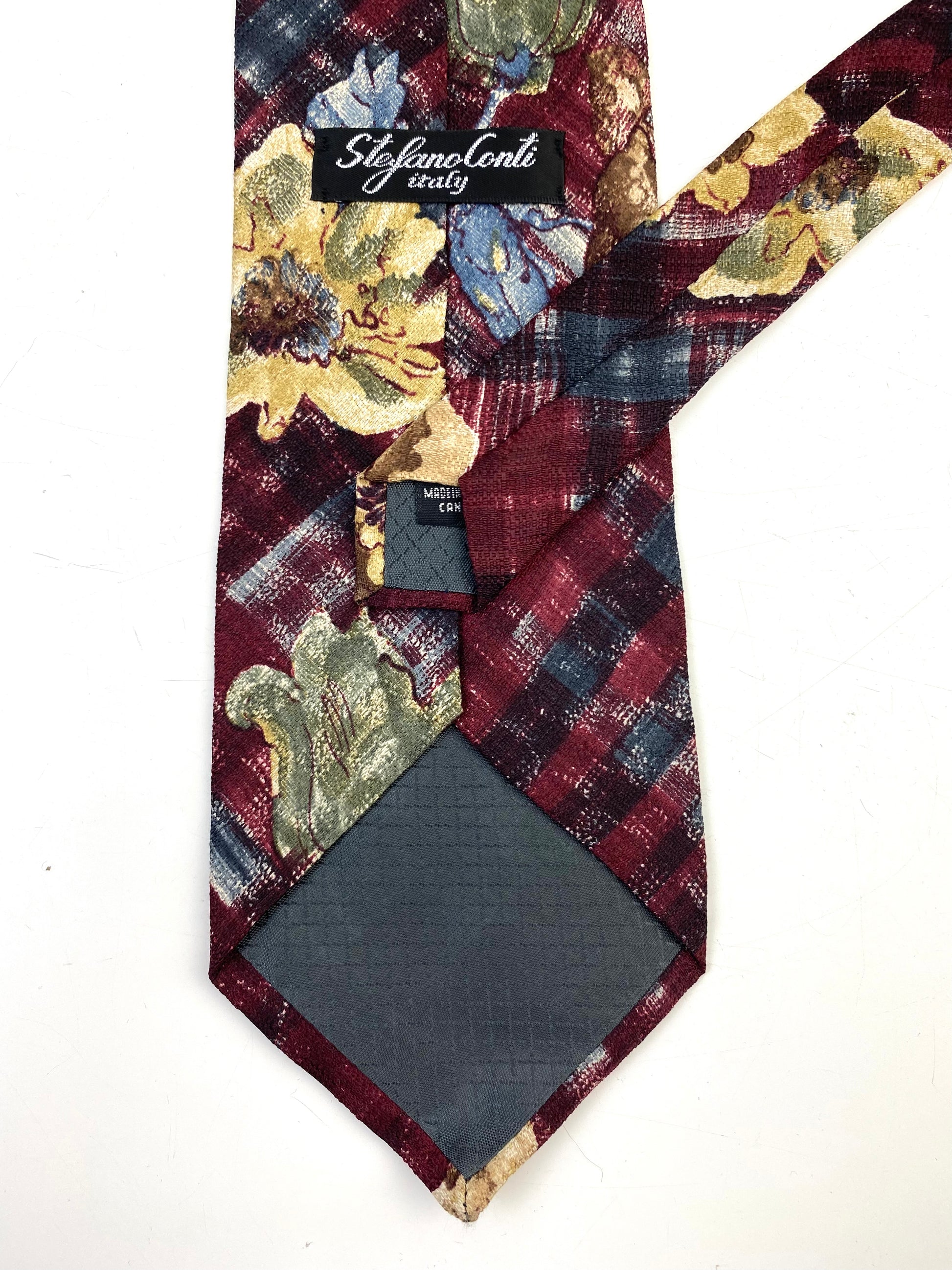 Back and labels of: 90s Deadstock Silk Necktie, Men's Vintage Wine/ Blue Floral Pattern Tie, NOS