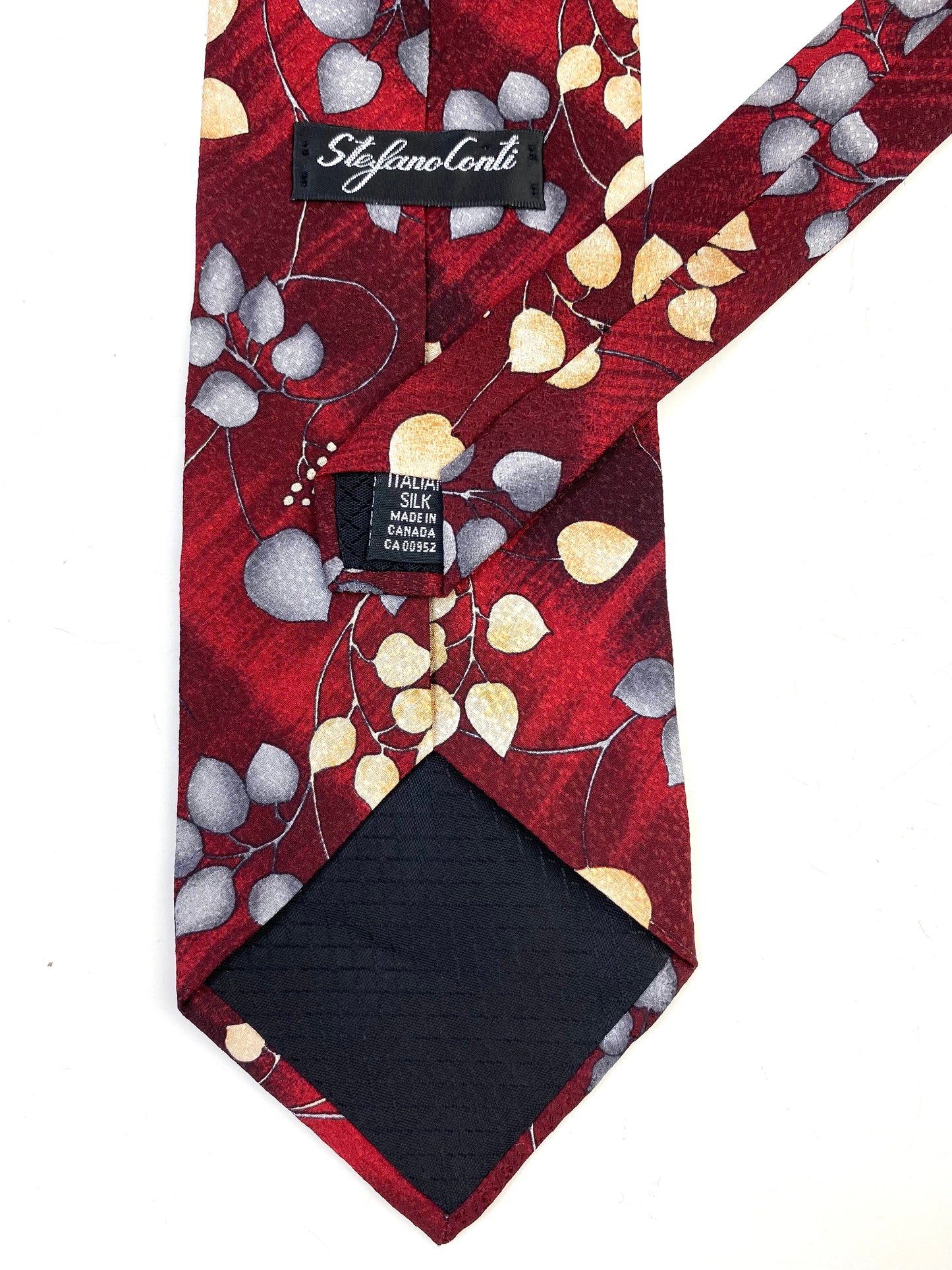 Back and labels of: 90s Deadstock Silk Necktie, Men's Vintage Wine/ Blue Botanical Pattern Tie, NOS