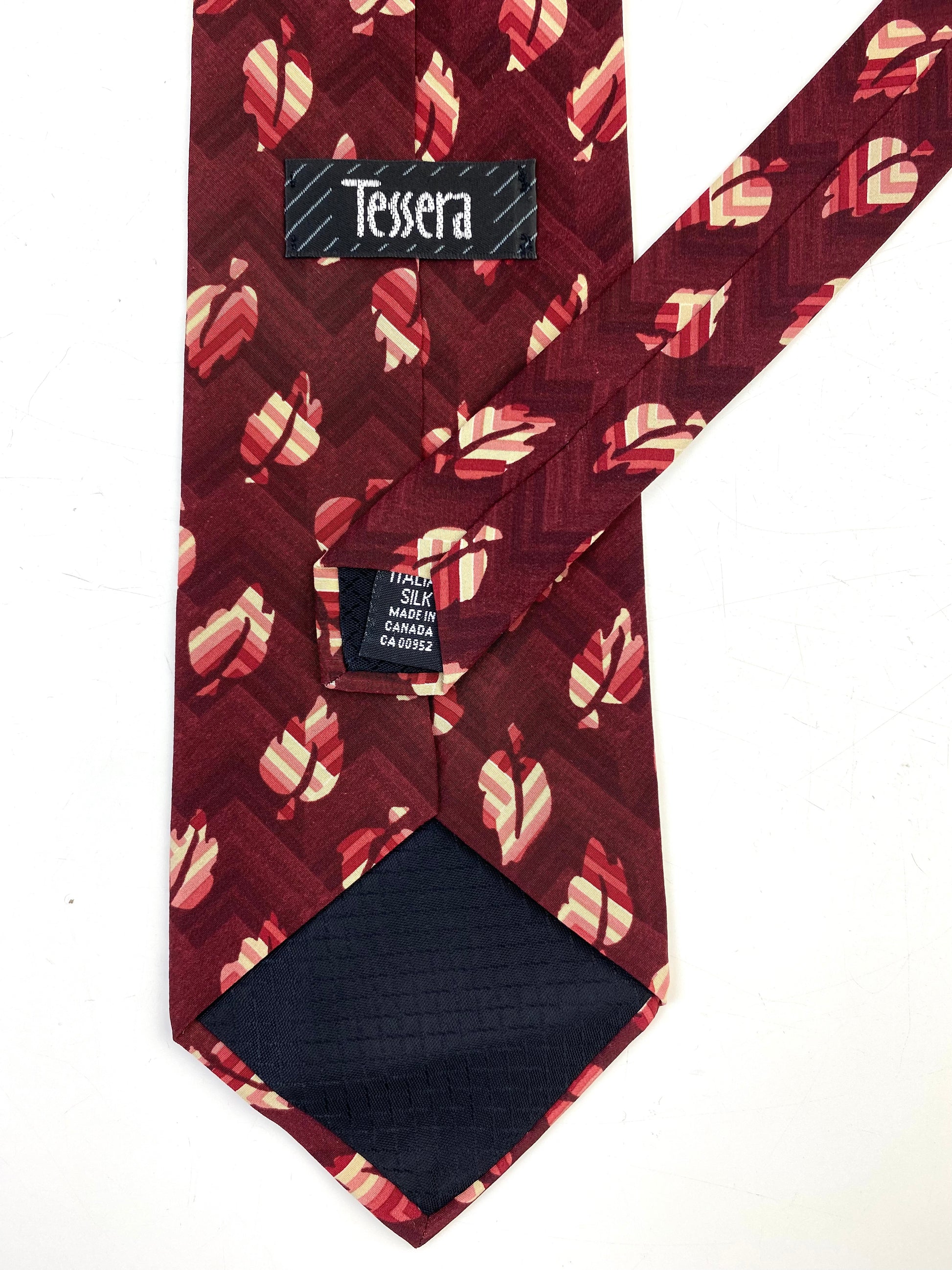 Back and labels of: 90s Deadstock Silk Necktie, Men's Vintage Wine/ Blue Leaf Pattern Tie, NOS