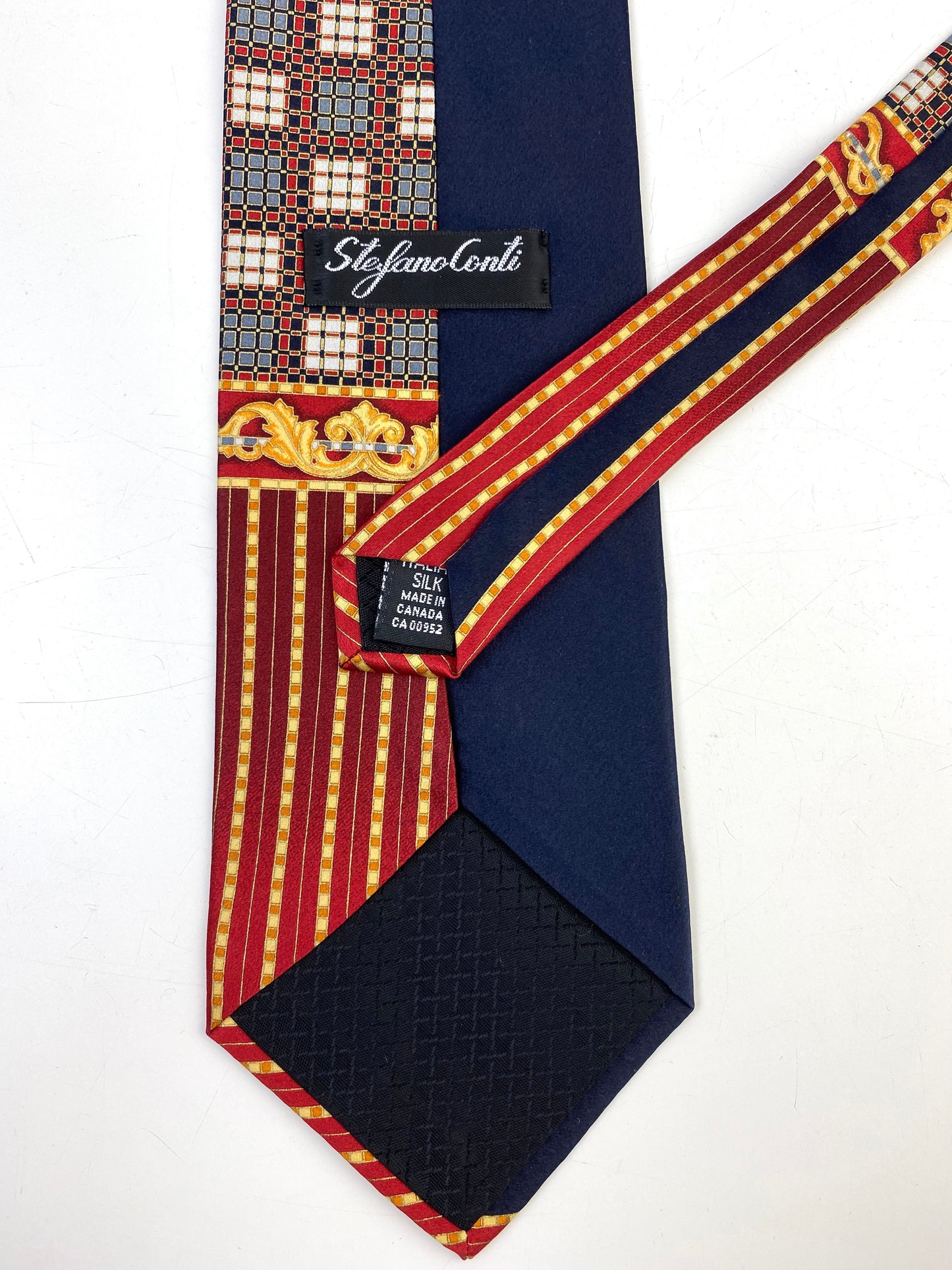 Back and labels of: 90s Deadstock Silk Necktie, Men's Vintage Gold/Navy/Red Stripe Filigree Pattern Tie, NOS
