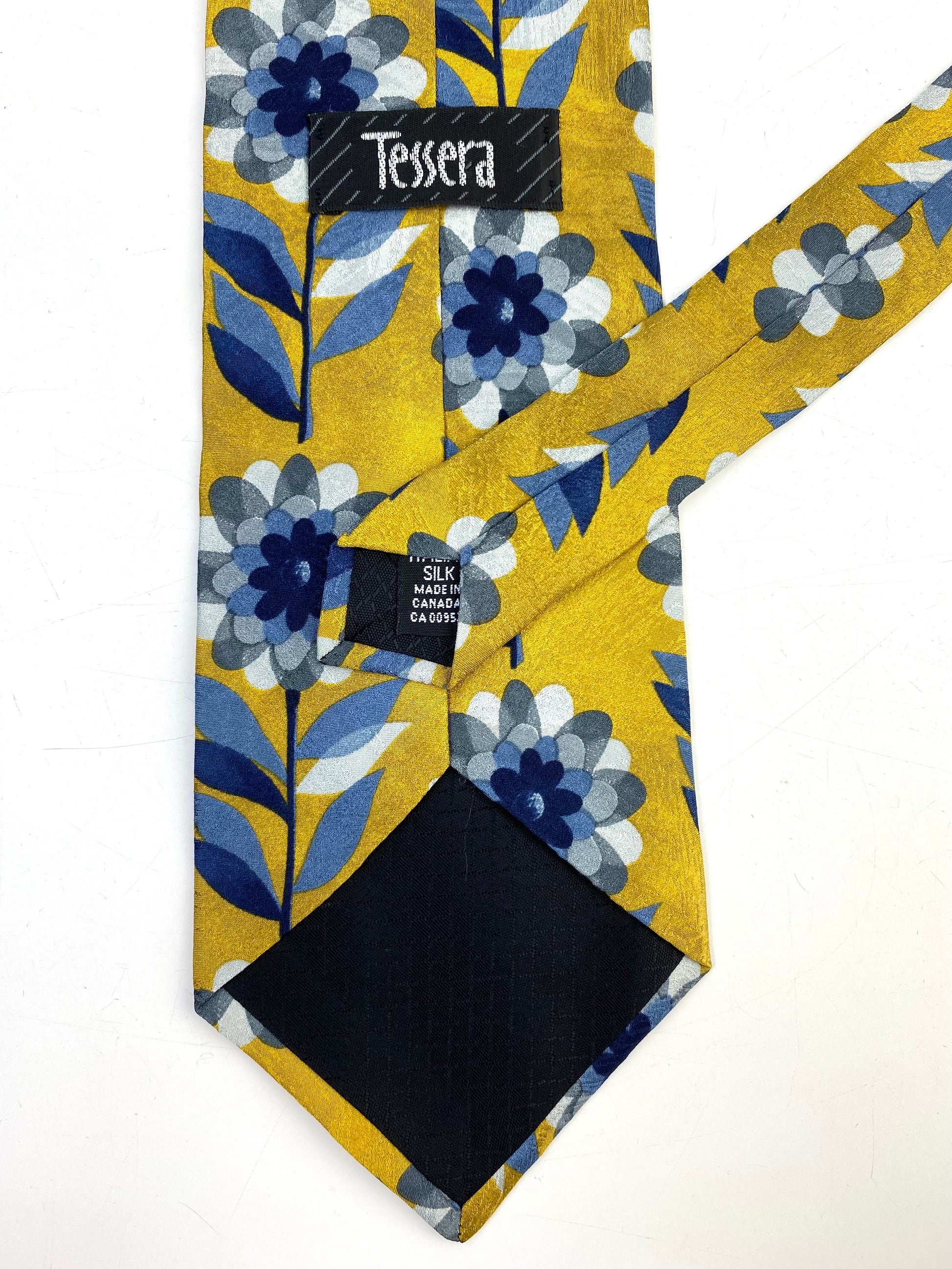 Back and labels of: 90s Deadstock Silk Necktie, Men's Vintage Gold/ Blue/ Grey Floral Pattern Tie, NOS