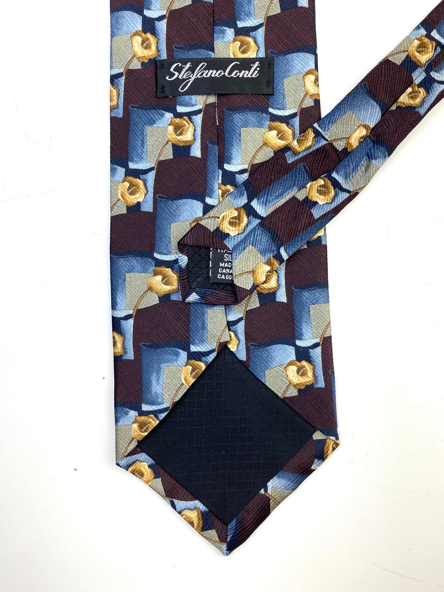 Back and labels of: 90s Deadstock Silk Necktie, Men's Vintage Wine Blue Abstract Floral Pattern Tie, NOS