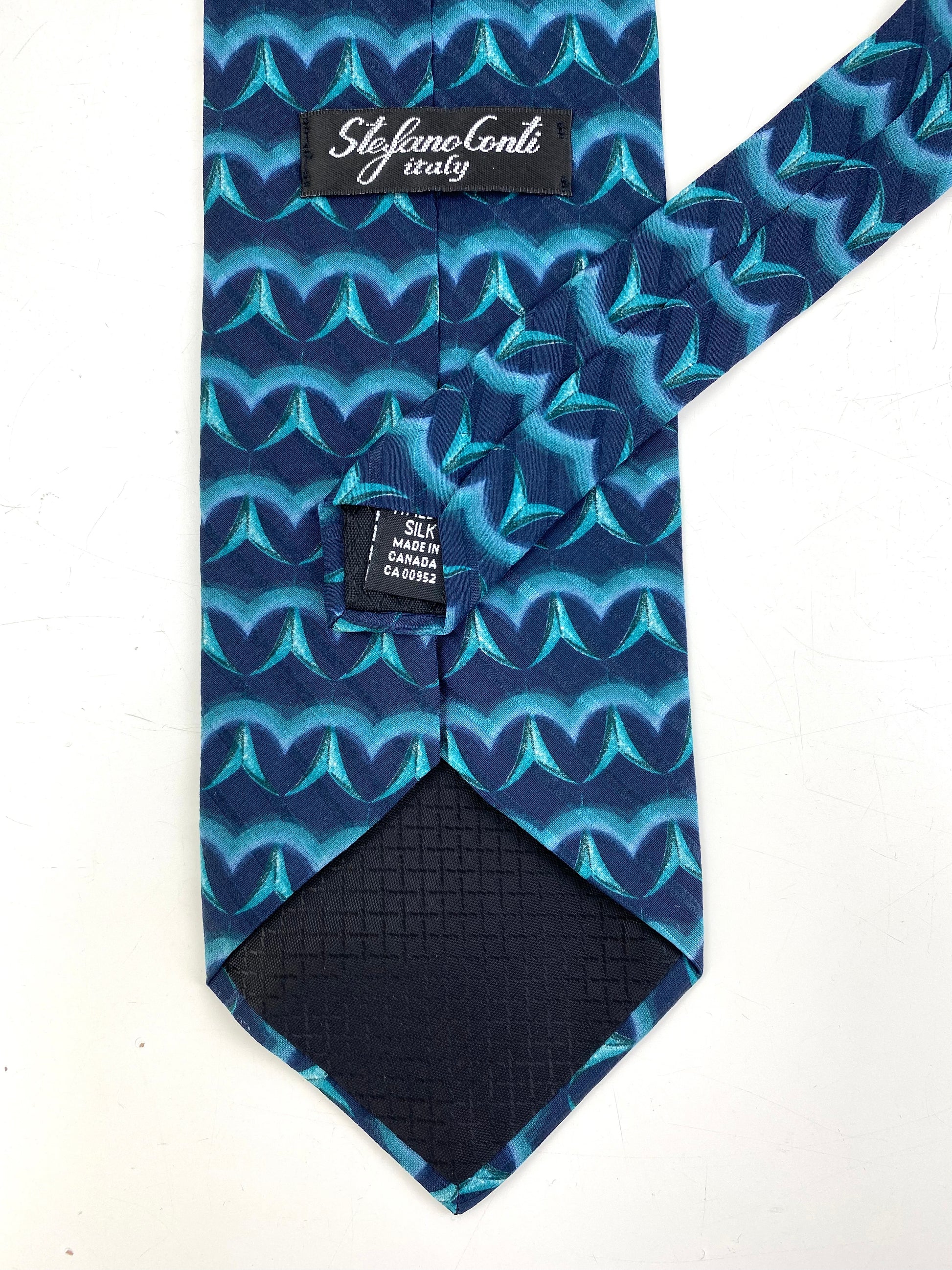 Back and labels of: 90s Deadstock Silk Necktie, Men's Vintage Teal Blue Abstract Pattern Tie, NOS