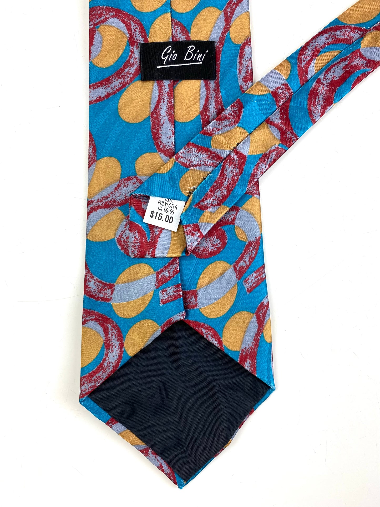 Back and labels of: 90s Deadstock Necktie, Men's Vintage Teal/ Red/ Yellow Swirl Dot Pattern Tie, NOS