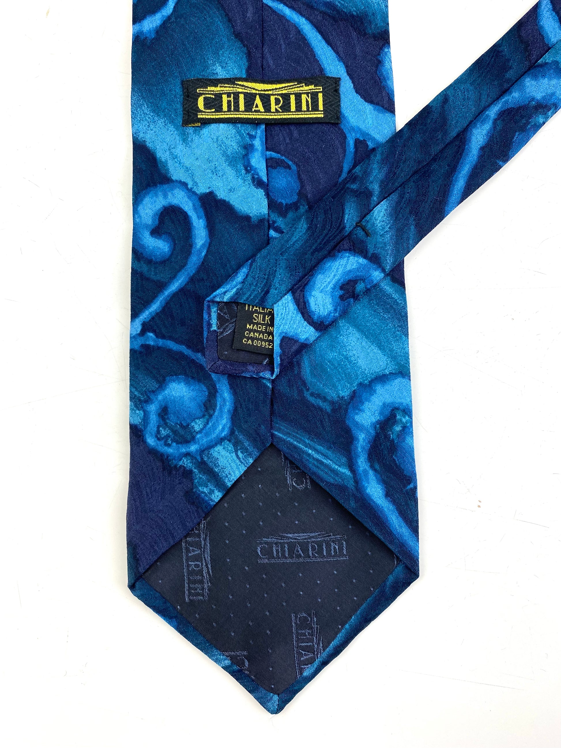 Back and labels of: 90s Deadstock Silk Necktie, Men's Vintage Teal/ Blue Abstract Pattern Tie, NOS