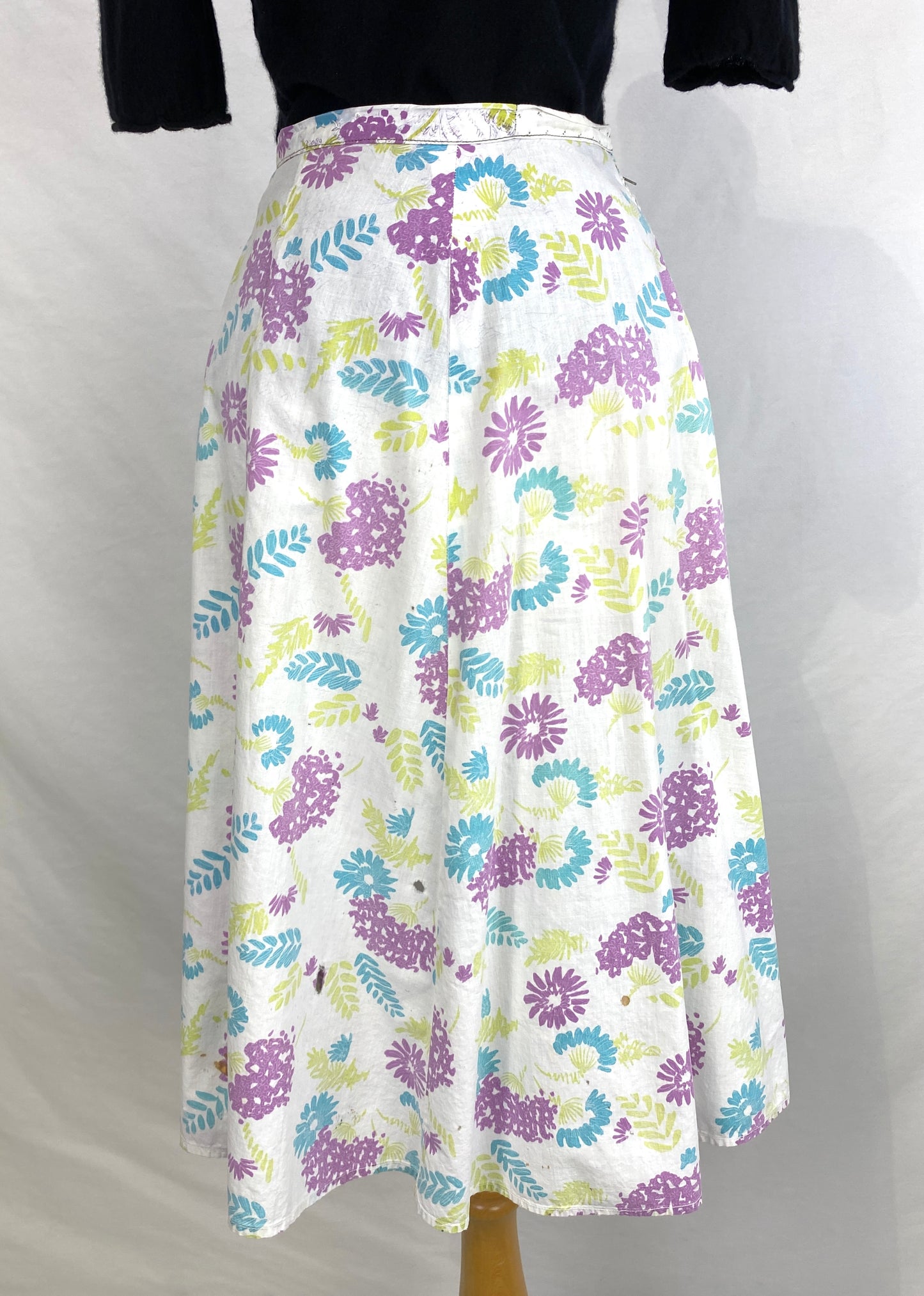 Front view of white purple blue green floral print 50s skirt. Ian Drummond Vintage. 