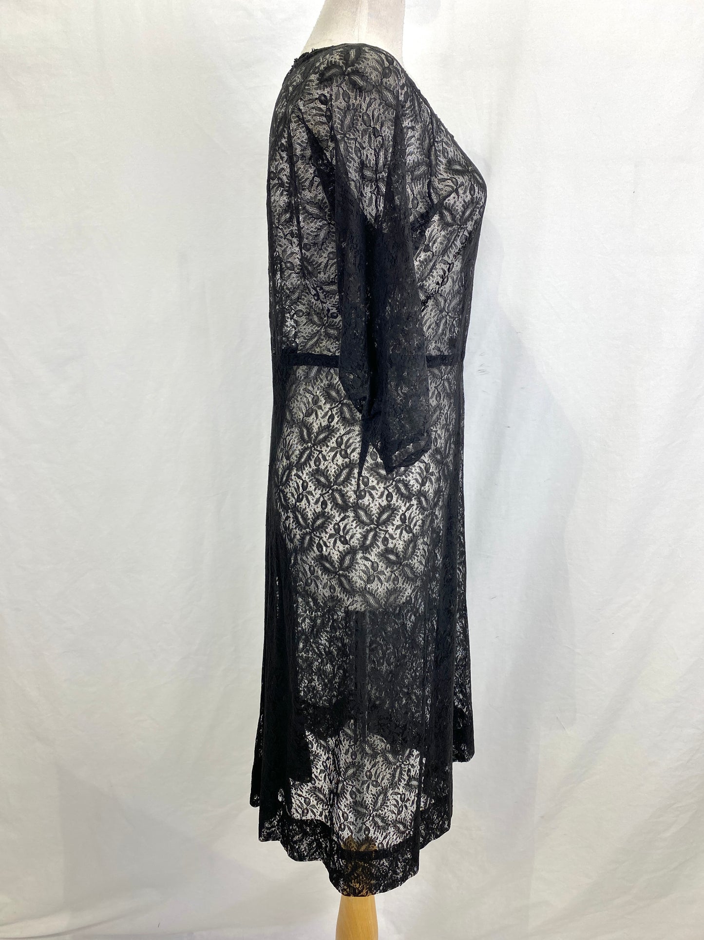 Right side view of black lace 3/4 sleeve 60s sheer dress. Ian Drummond Vintage.  