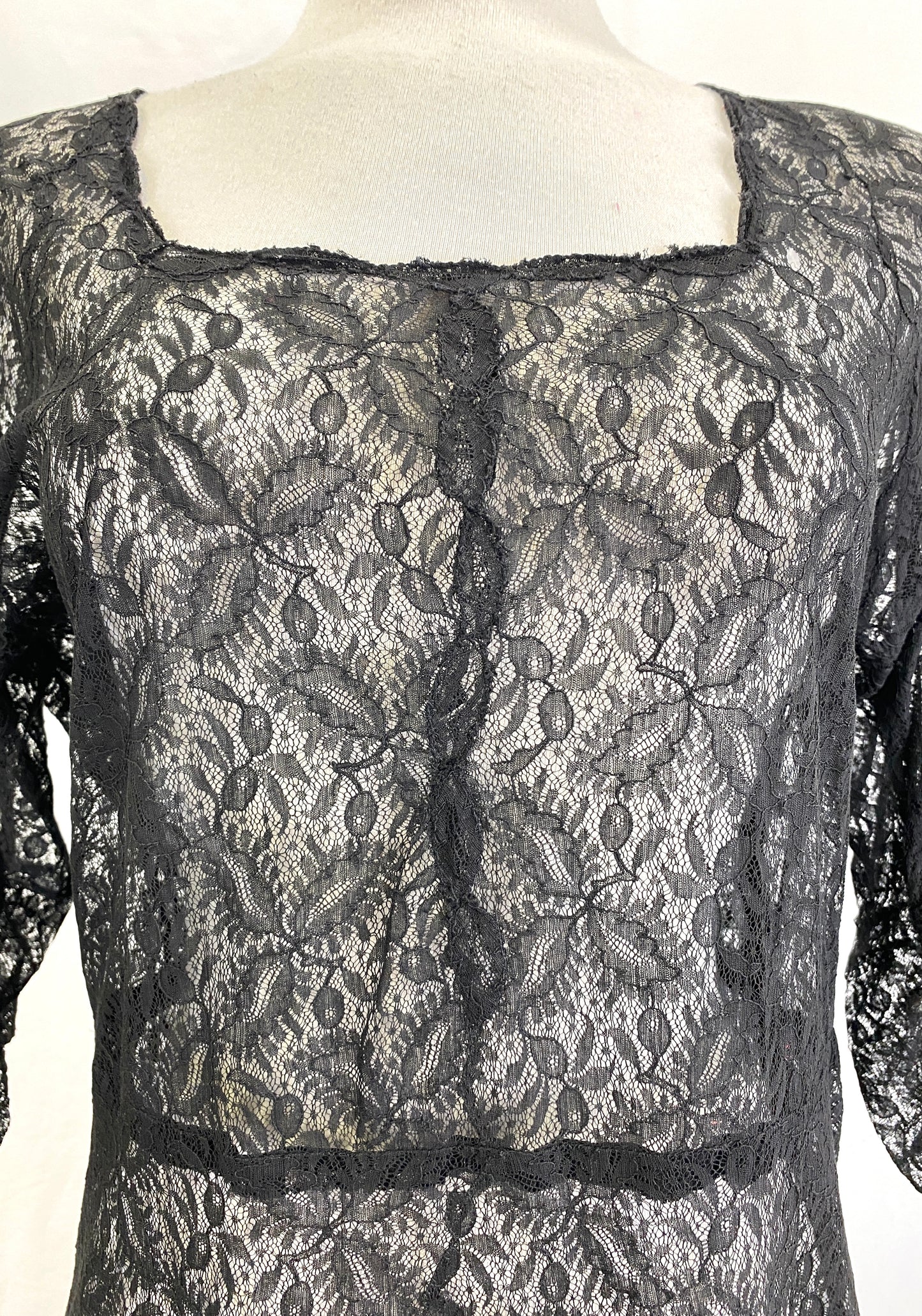 Close-up detail of front of black lace 60s dress. Ian Drummond Vintage. 