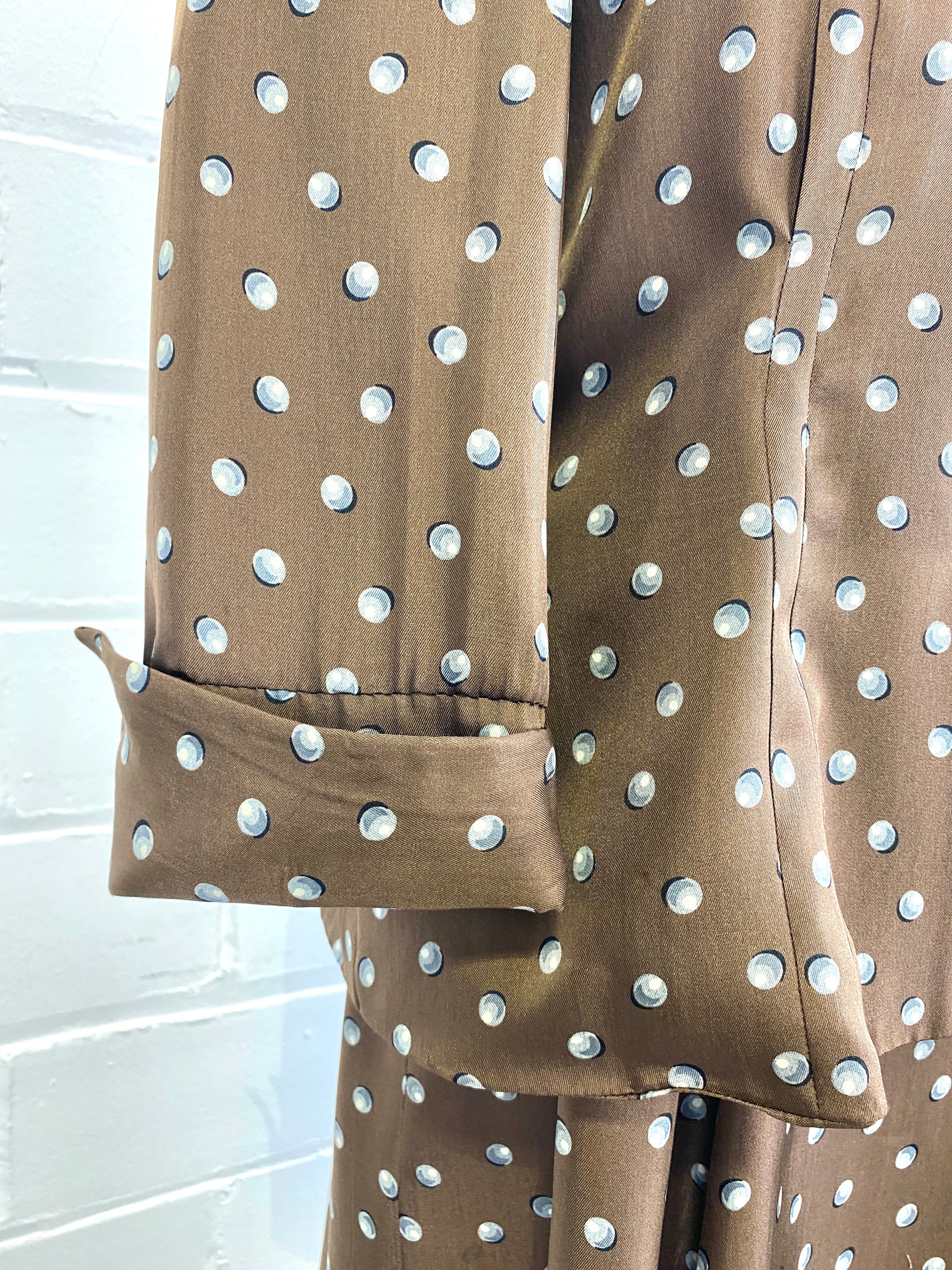 Sleeve cuff of 1950s brown silk jacket. Ian Drummond Vintage.