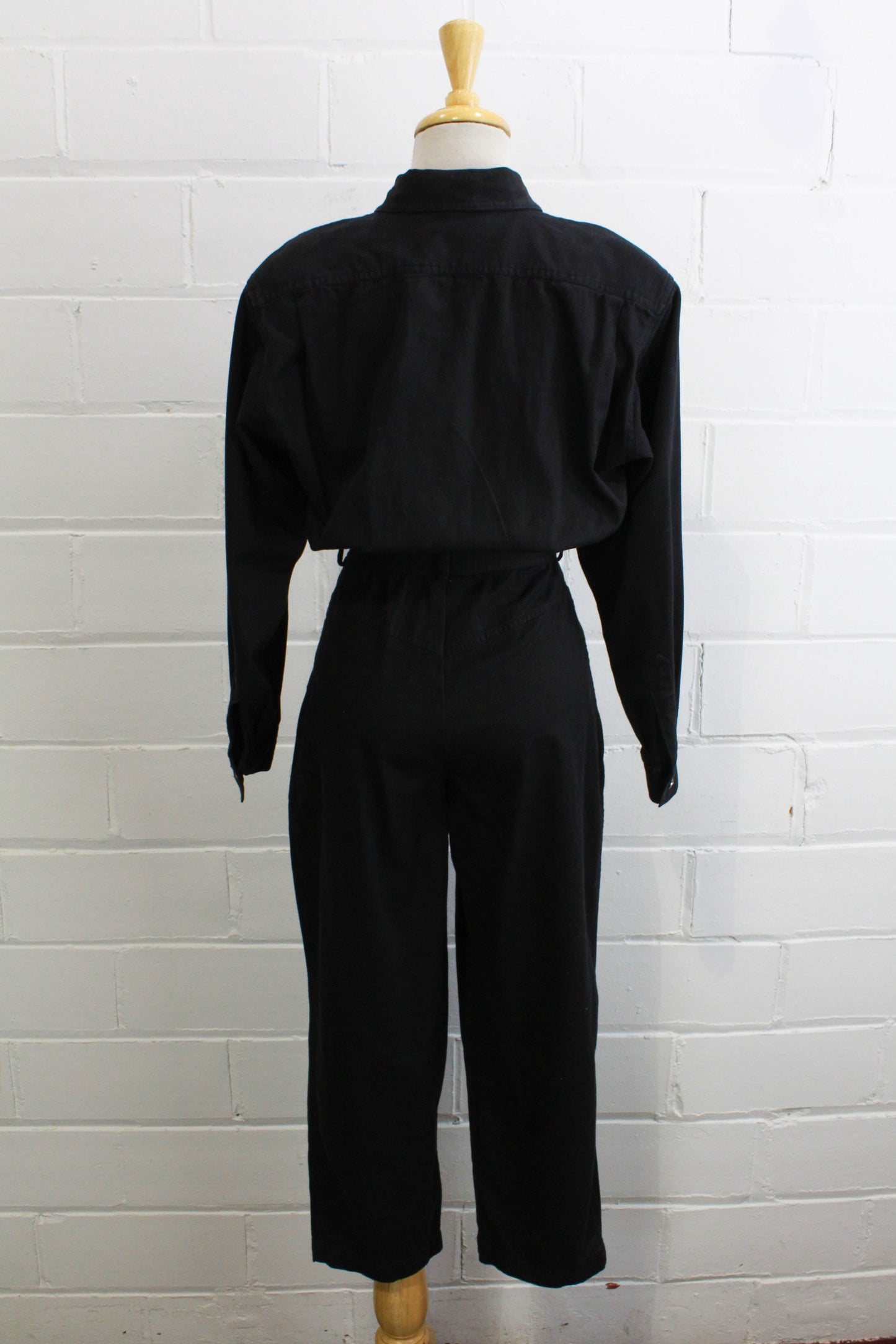 1980s womens jumpsuit black cotton with bib front, collar button up back view