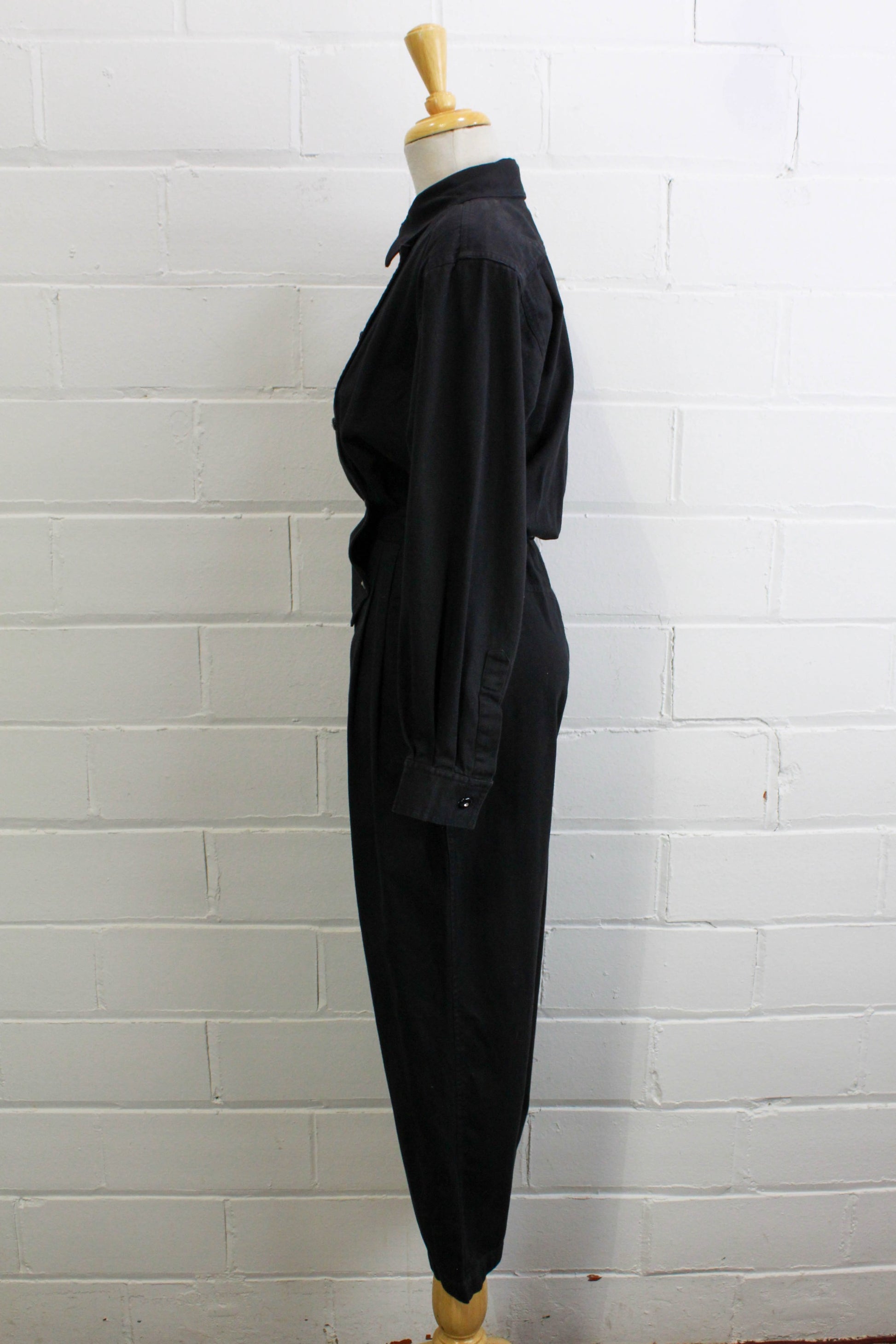 1980s womens jumpsuit black cotton with bib front, collar button up side view