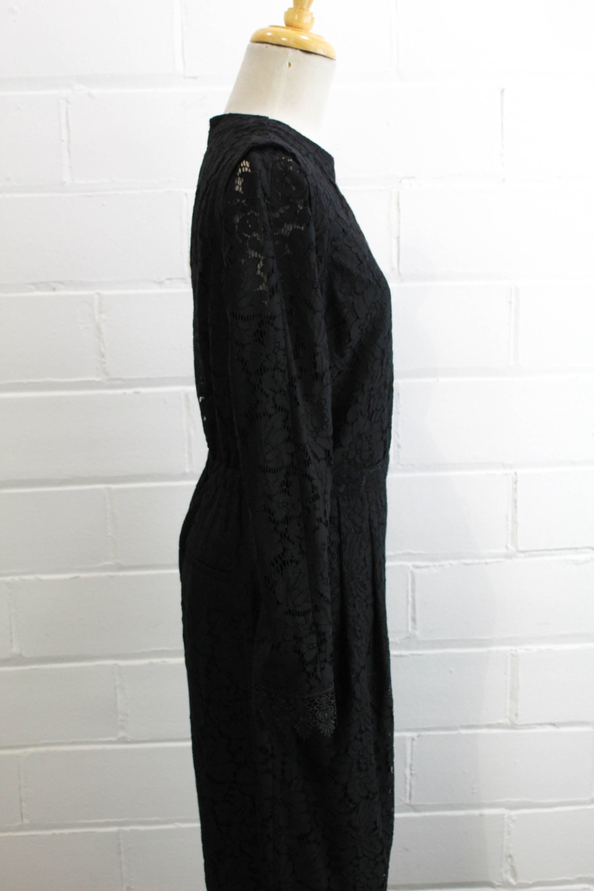 black lace jumpsuit party holiday outfit sheer lace sleeves side view close up