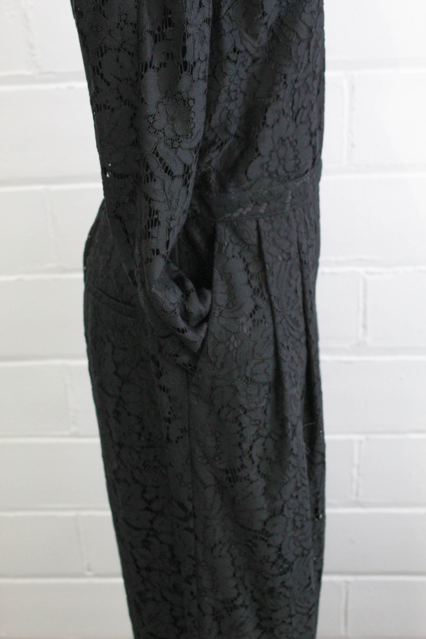 black lace jumpsuit party holiday outfit sheer lace sleeves pocket close up