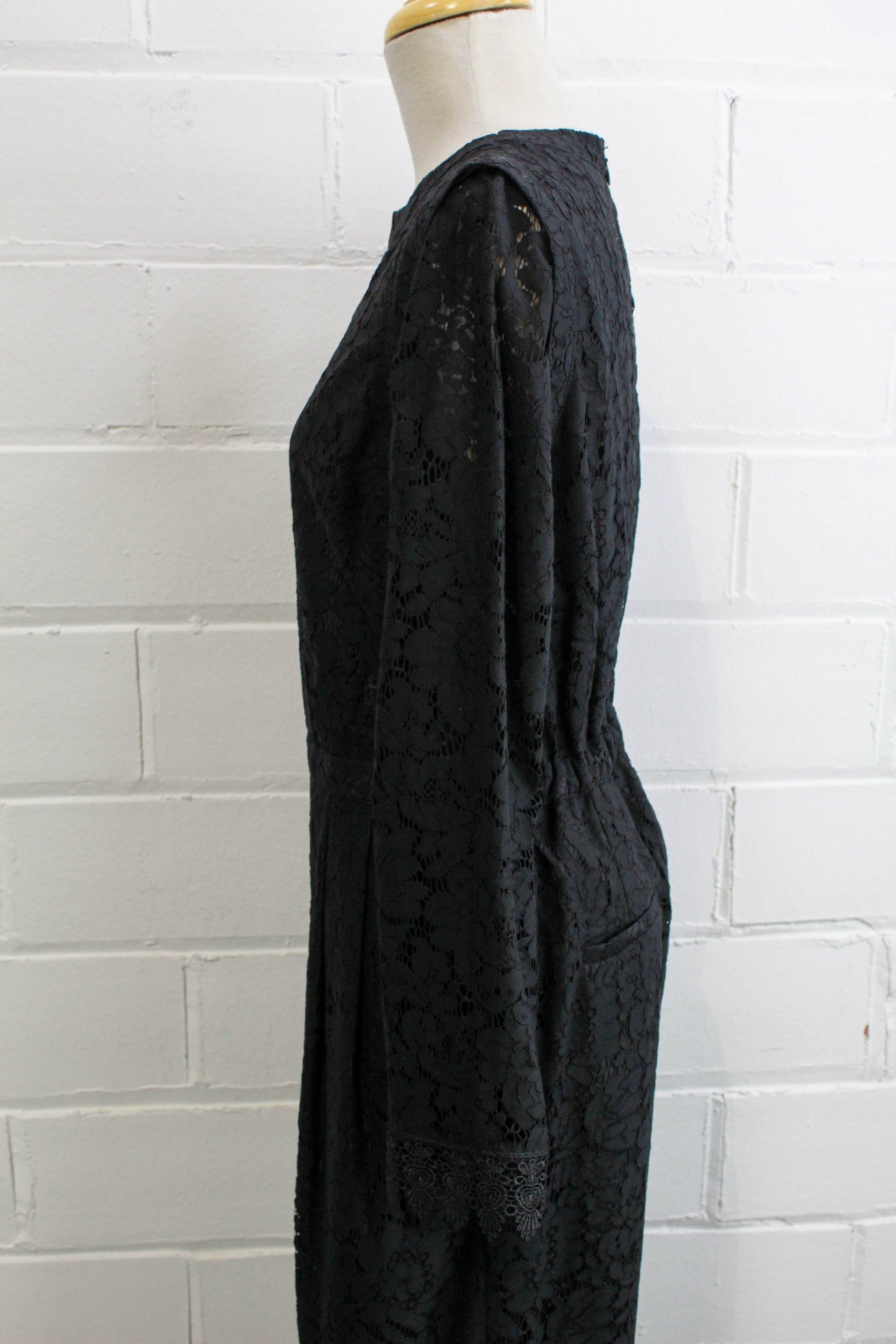 black lace jumpsuit party holiday outfit sheer lace sleeves side view close up