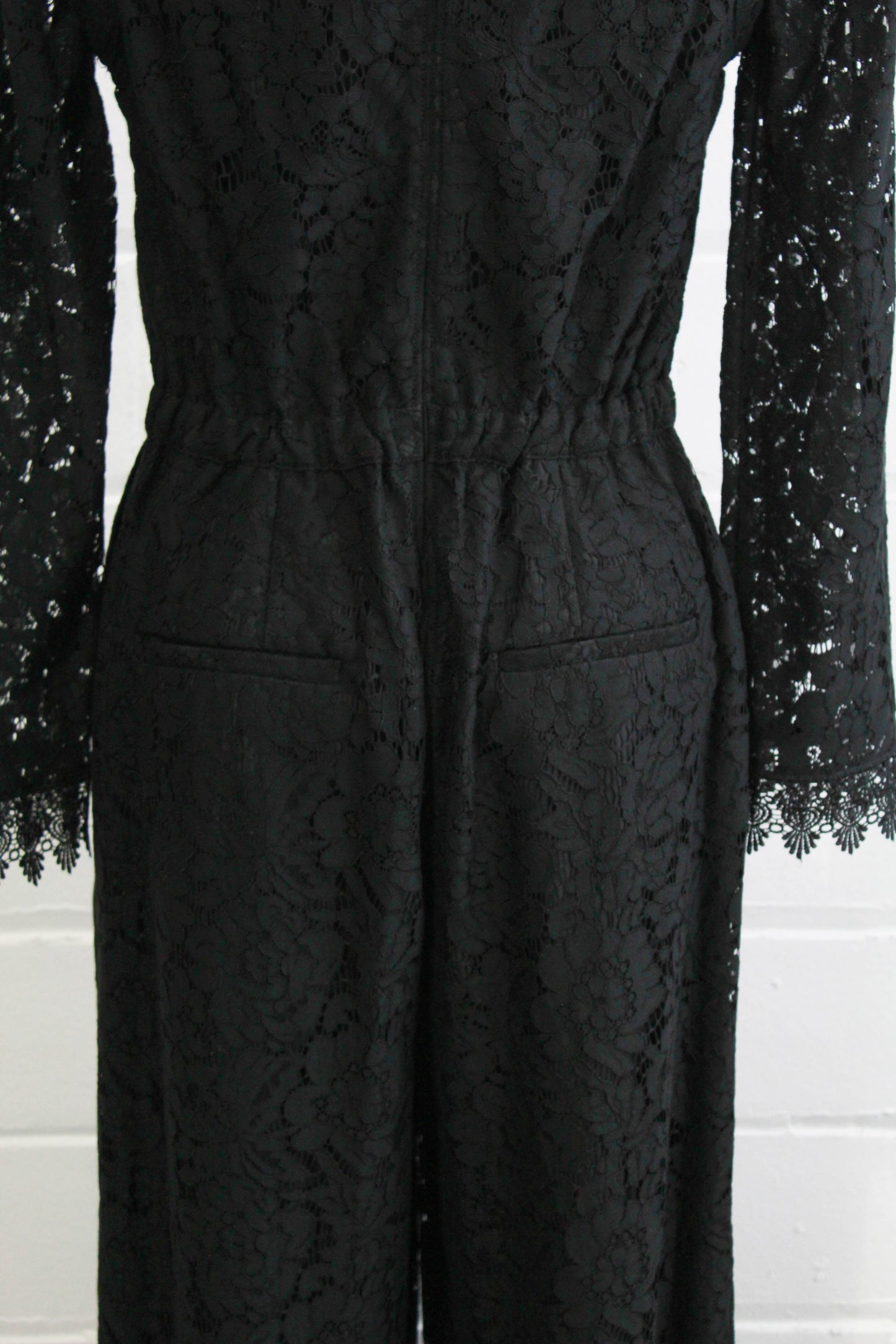 black lace jumpsuit party holiday outfit sheer lace sleeves back view close up