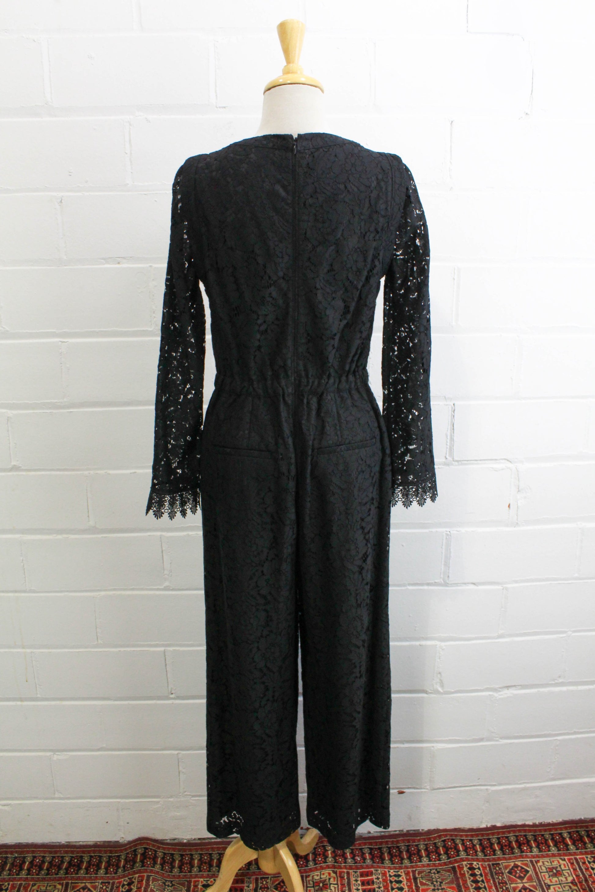 black lace jumpsuit party holiday outfit sheer lace sleeves back view