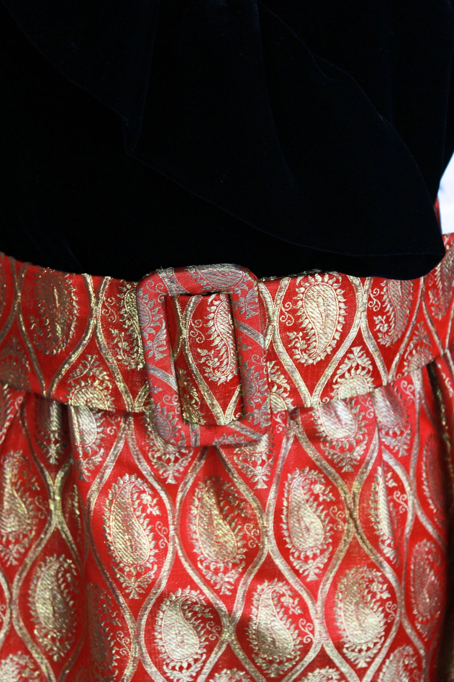 1970s maxi dress black velvet with red and gold metallic brocade skirt, ruffle collar belt close up