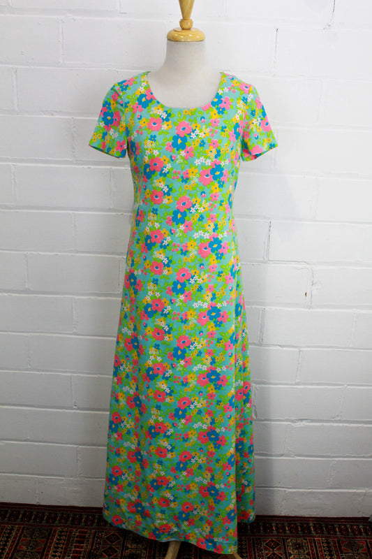 1960s floral print maxi dress short sleeves, blue with bright pink yellow and green flowers