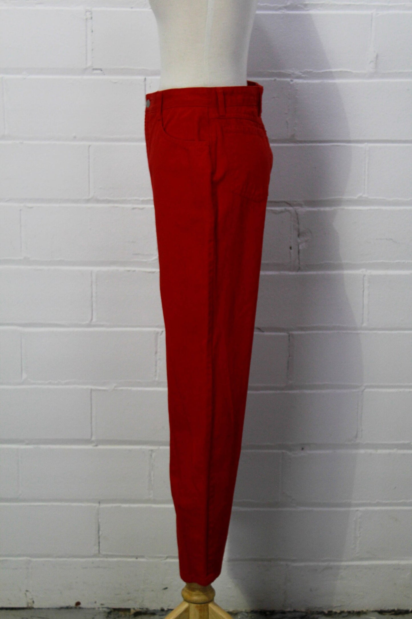Perfect 80s red cotton high waisted denim jeans by Bongo. They have a 5 pocket design, and the Bongo logo on the back waist that reads "Always American Made". 